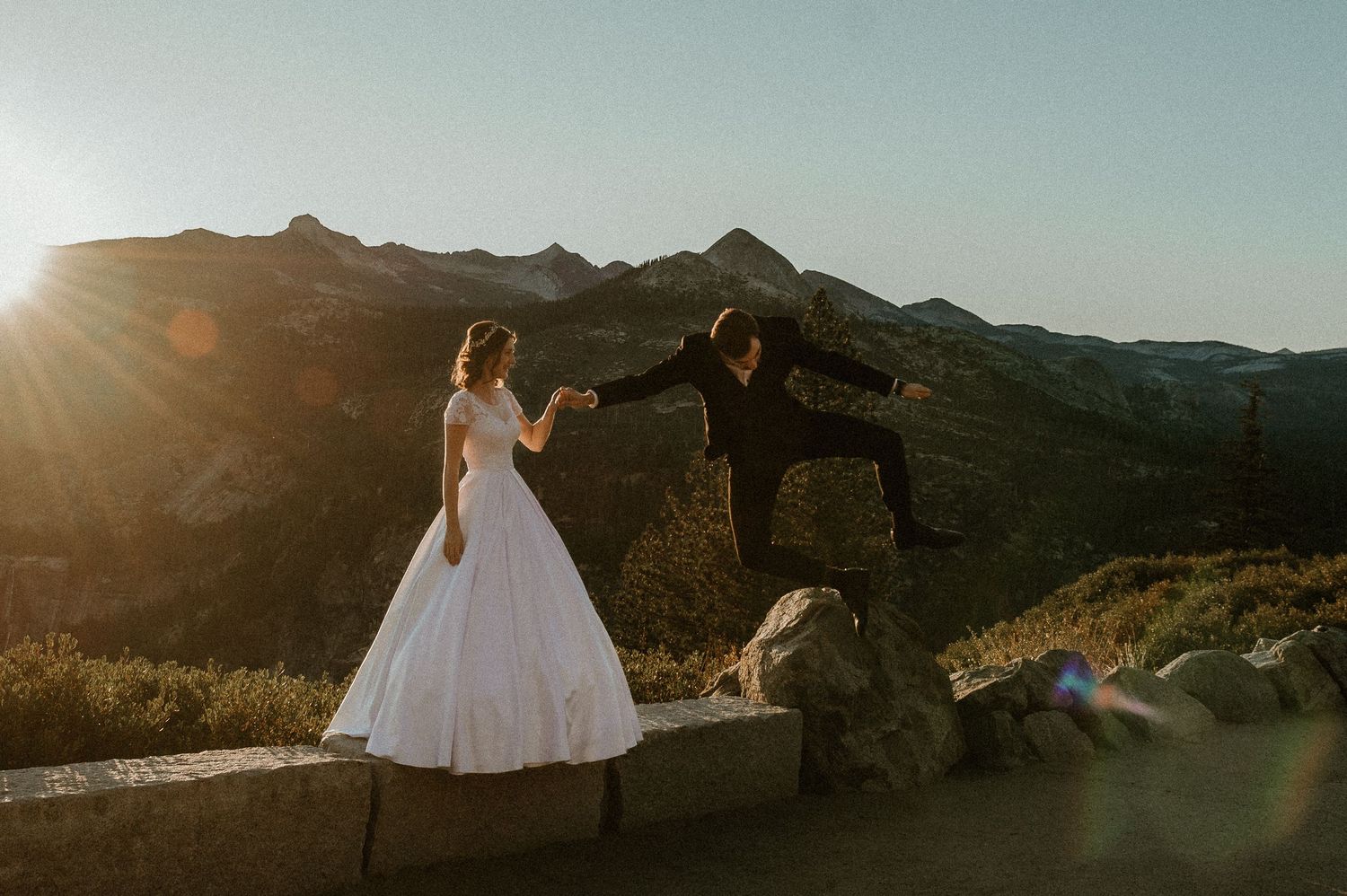 Stunning mountain wedding photography at sunset with dramatic landscapes in the background.