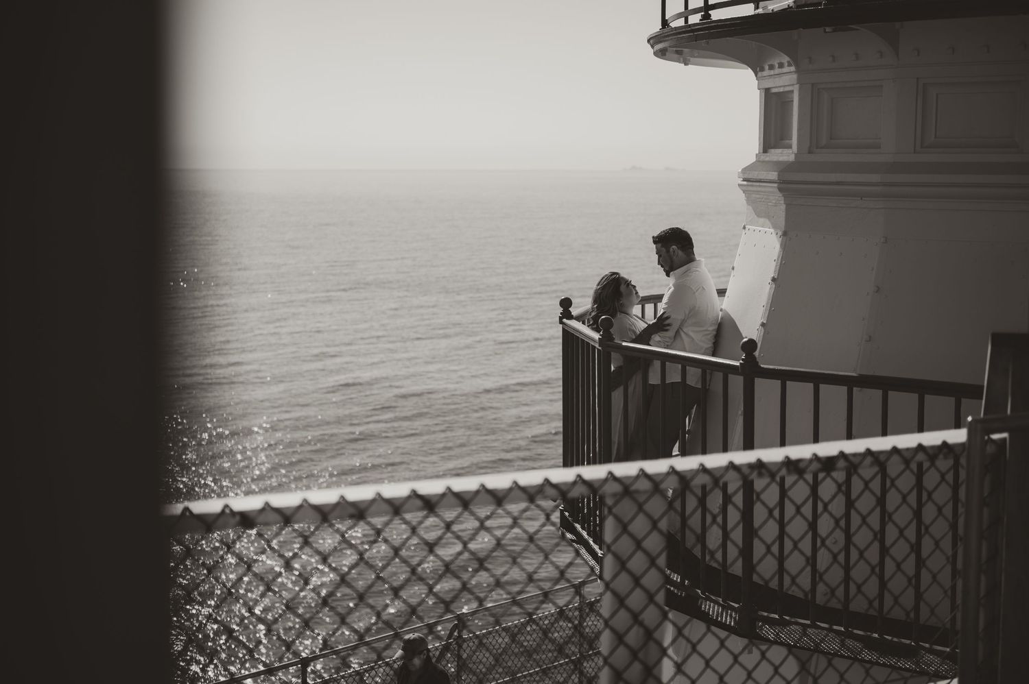A series of black and white photographs showing a lighthouse keeper's daily life and duties at a coastal station.