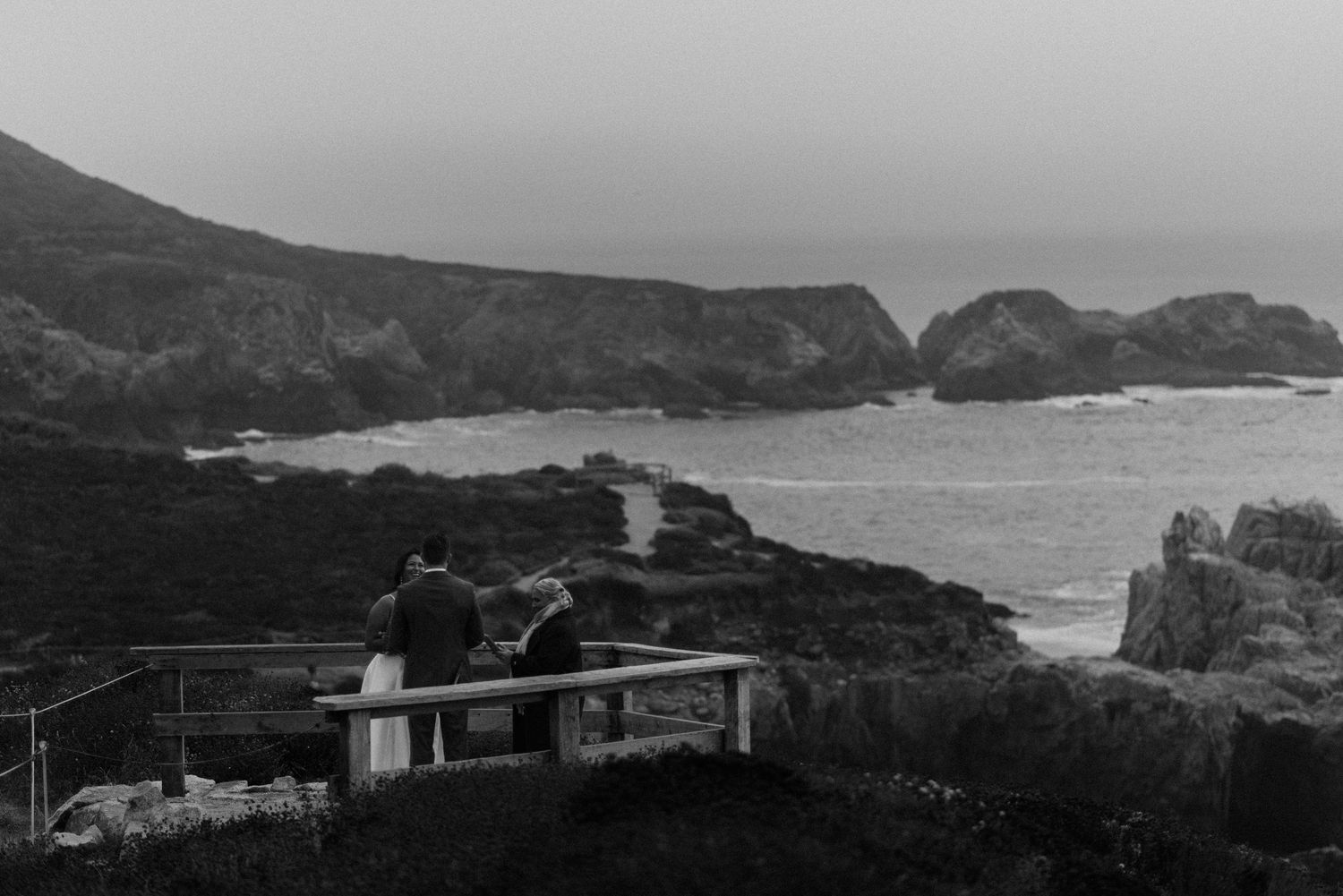 Dramatic coastal landscape with rocky cliffs and ocean views in panoramic format.