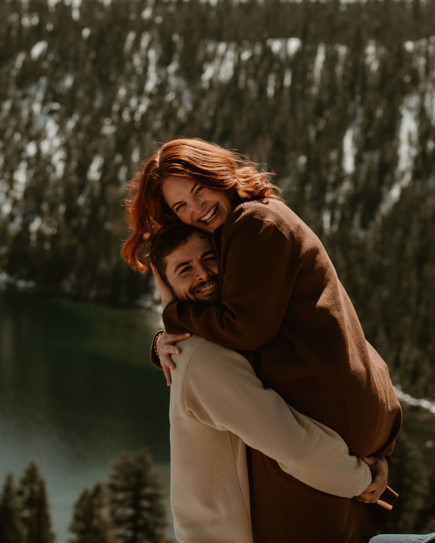 A playful spin captured against a mountainous landscape with a lake in the background.