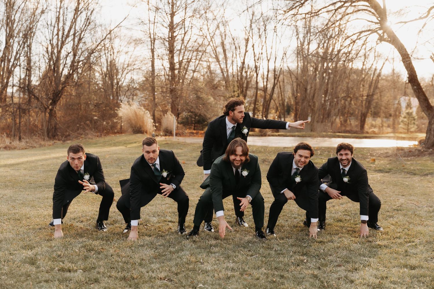 A creative wedding party poses in sequence showing progressive movement from standing to crouching positions.