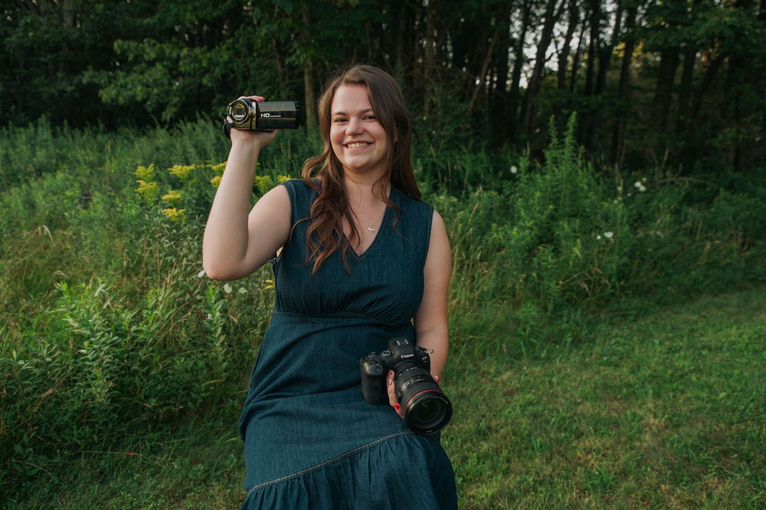 Natural outdoor portrait session in a wooded area with green foliage.