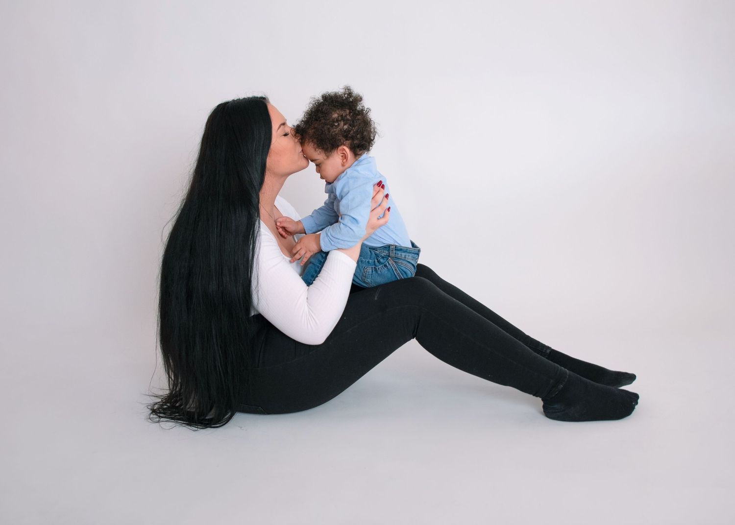 Professional studio photography backdrop in white and cream tones.