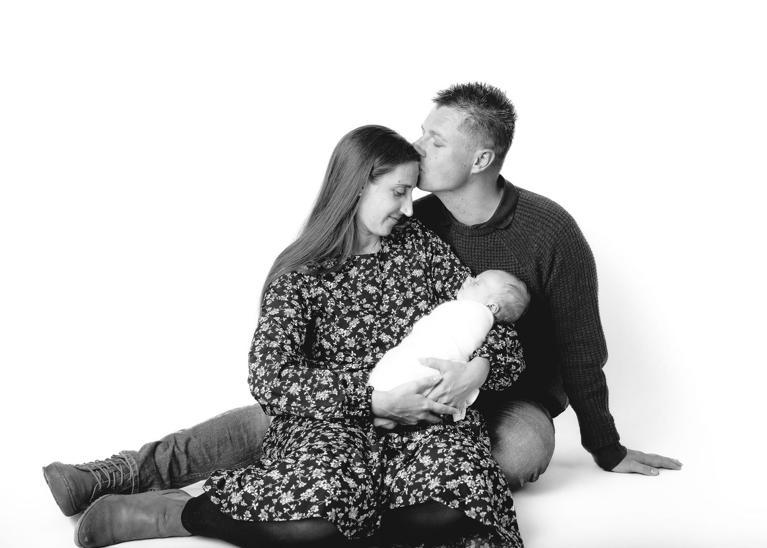 Black and white portrait series of family members bonding together.
