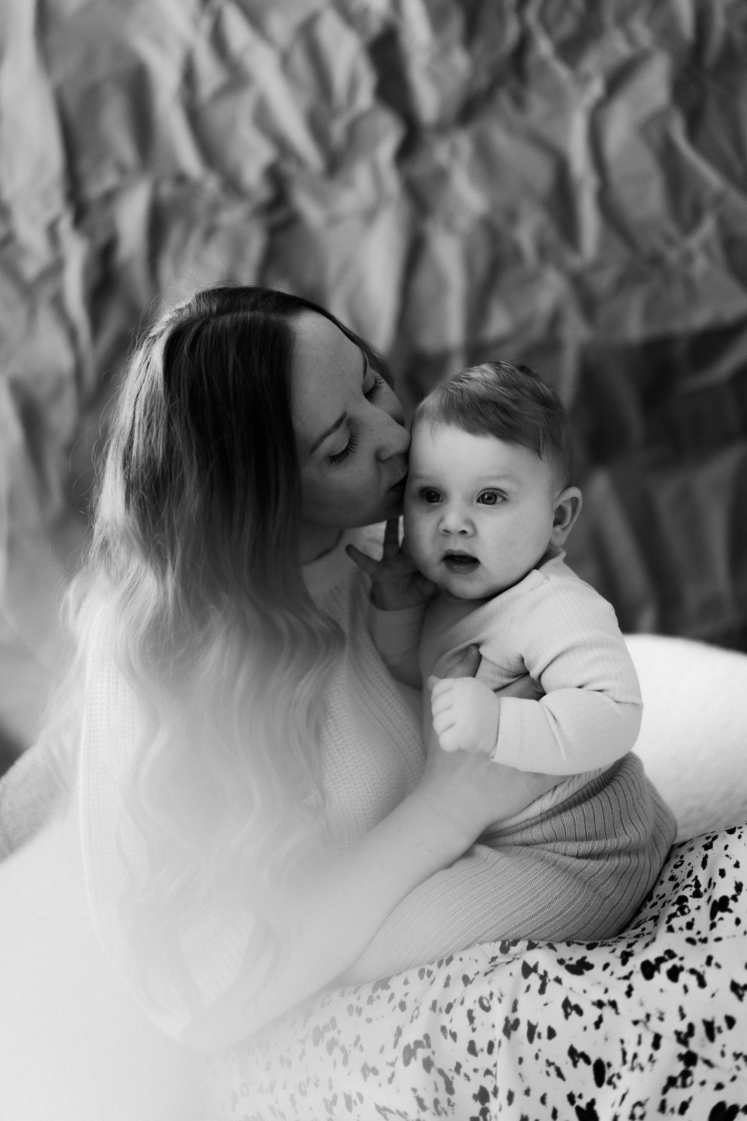 A tender black and white photo series showing intimate moments between parent and child.