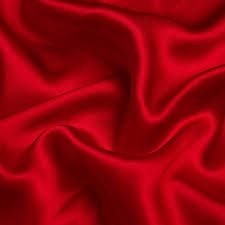 Smooth red satin fabric with elegant flowing folds and luxurious sheen.