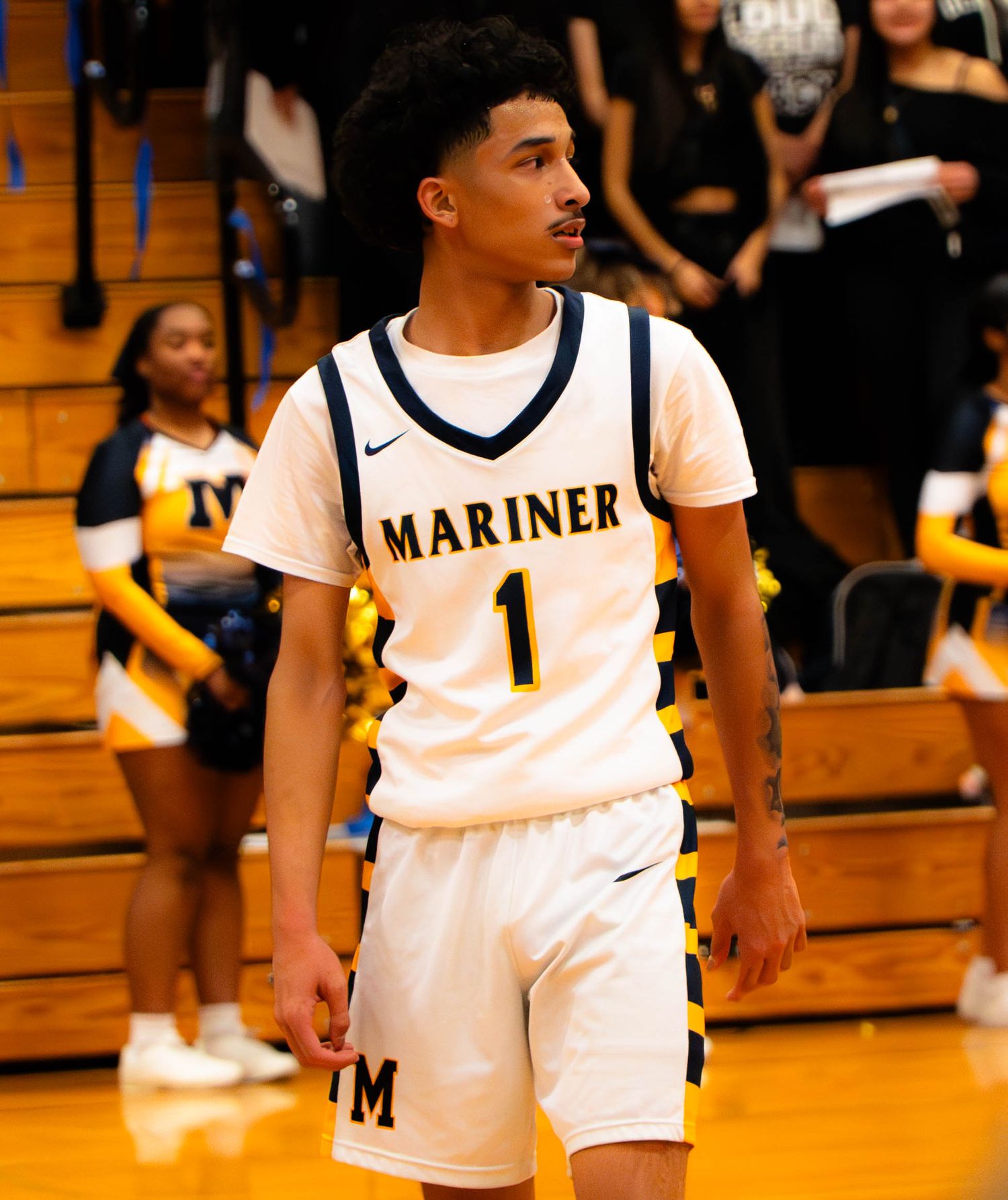 Mariner High School basketball player number 1 looks up court during a home game.