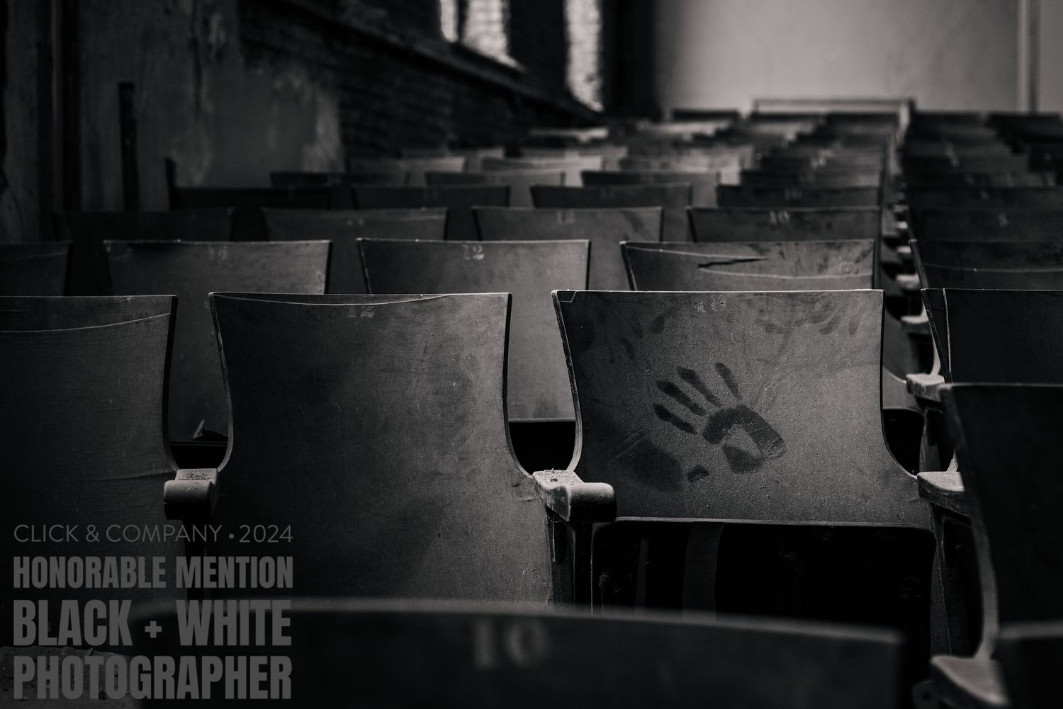 A lone handprint on a seat in the JW Cooper School Auditorium. Honorable mention: B&W, Best Photographer contest 2024. Tracey Richvalsky