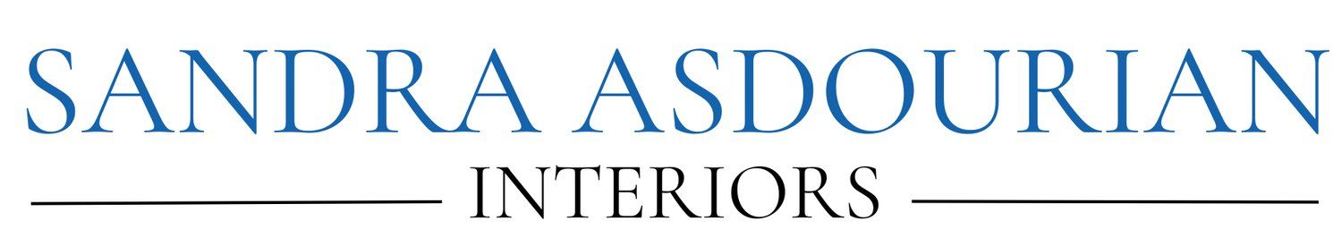 Sandra Asdourian Interiors company logo in dark blue text on white background.