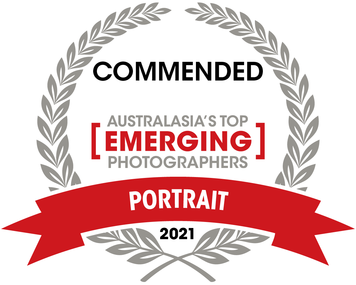 Gray laurel wreath award badge for Australasia's Top Emerging Portrait Photographers 2021.