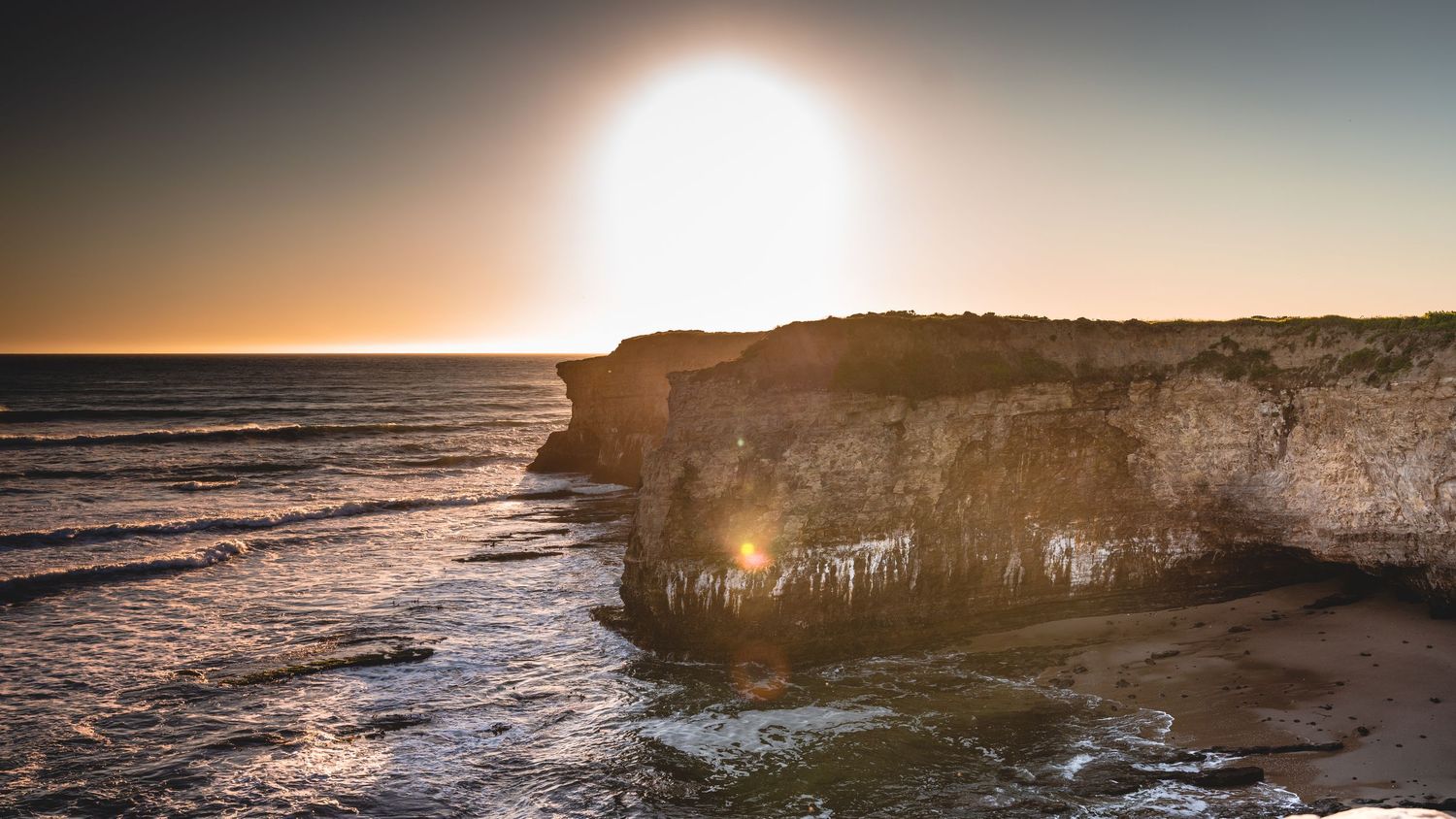 Sunset over coastal cliff