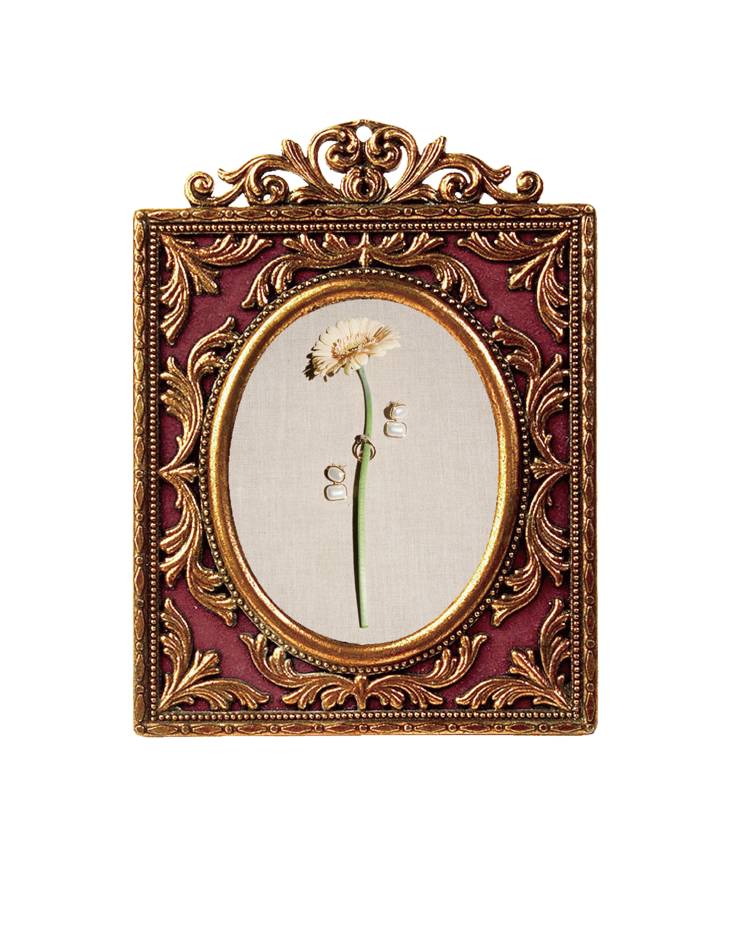 Ornate gold and burgundy baroque picture frame with oval window displaying pressed white daisy flower on linen background.