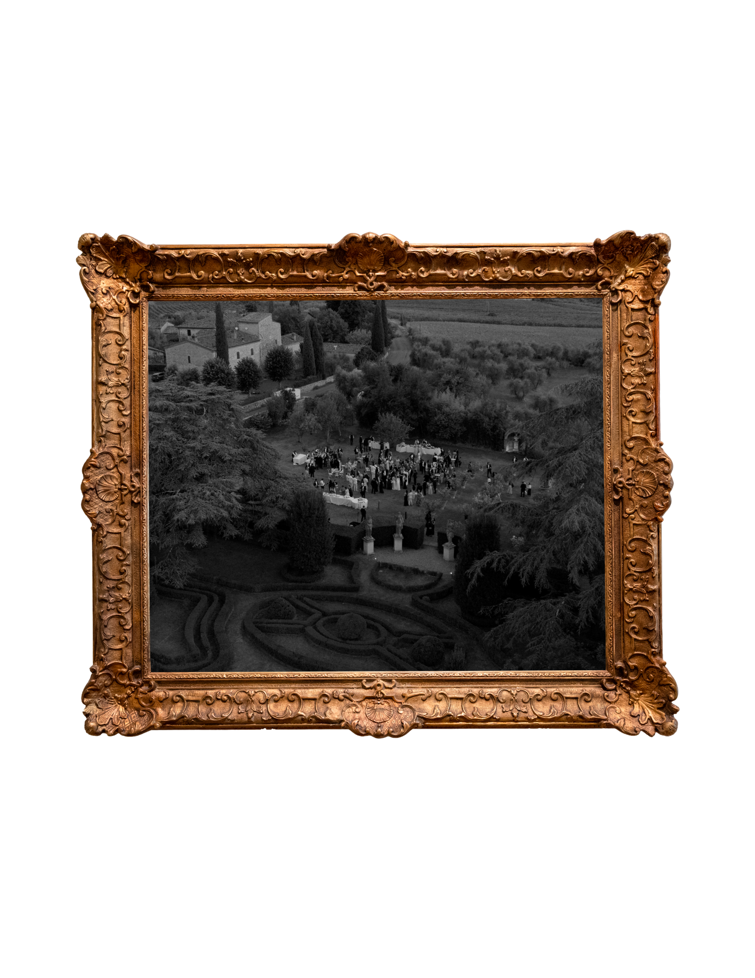 Aerial black and white photo in ornate gold frame showing formal garden with gathering crowd and cypress trees.