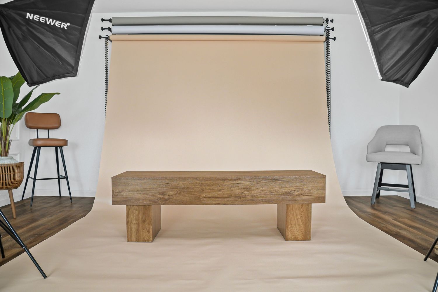 Natural solid wood bench with chunky block legs photographed in professional studio with softbox lighting.