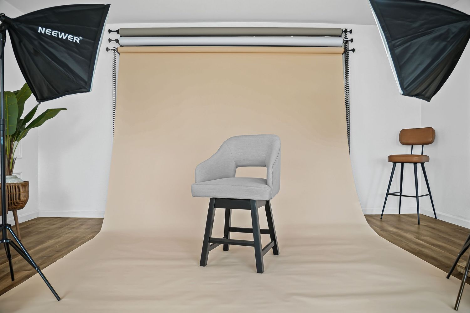 Gray swivel counter stool with upholstered seat photographed in professional studio with softbox lighting.