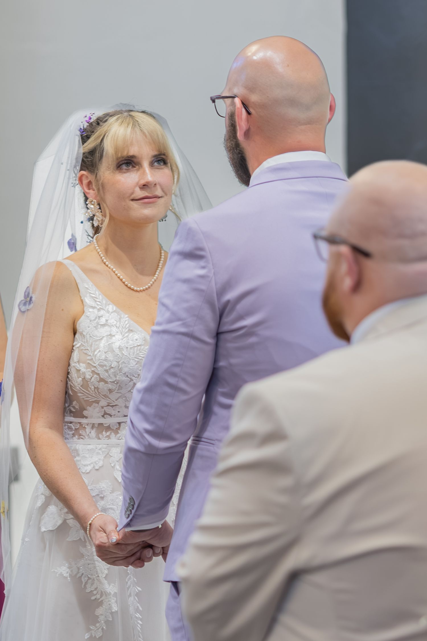 Bride and groom sharing joyful moments on their wedding day with timeless portraits, candid emotions, and elegant details.