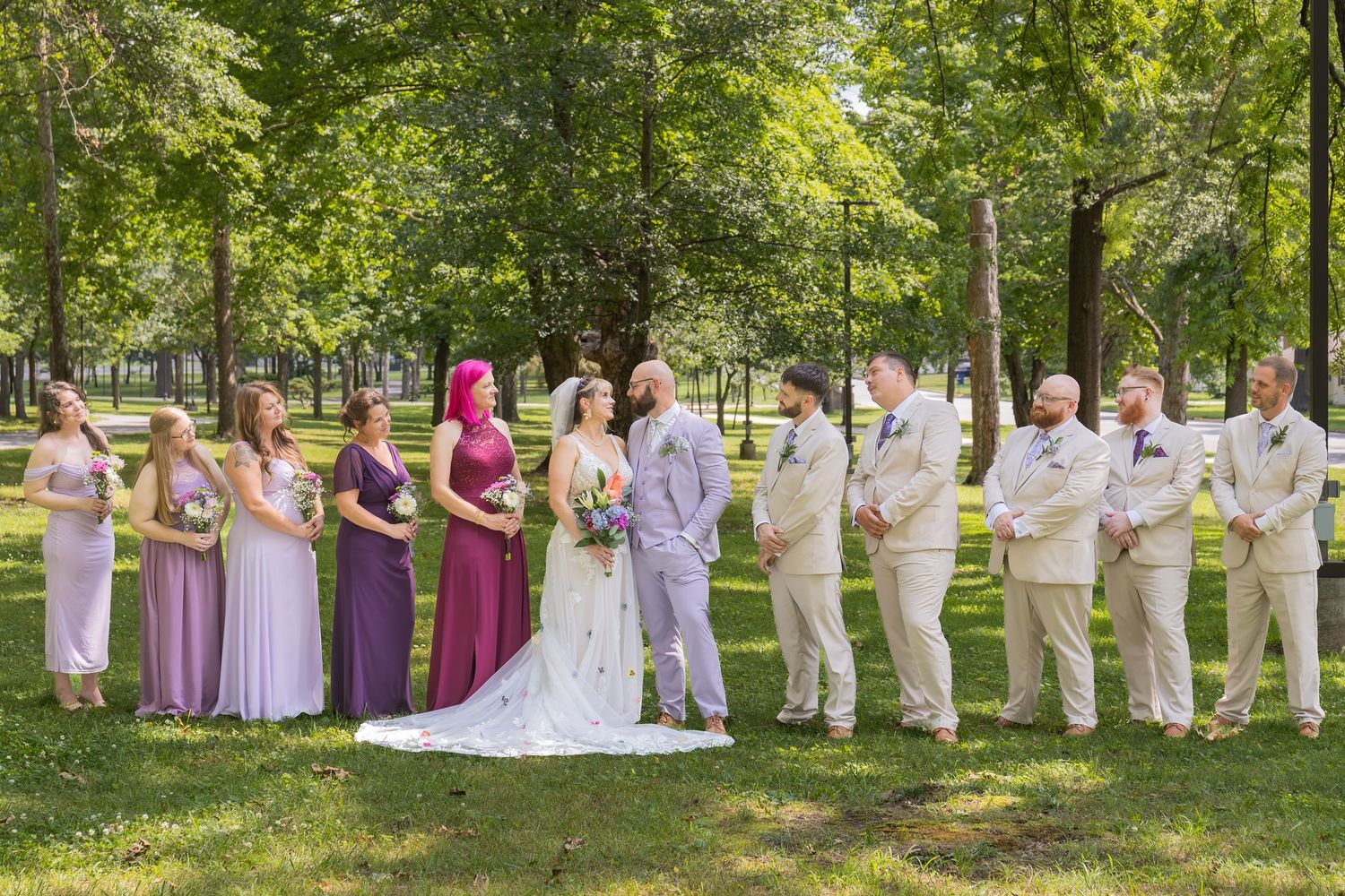 Bride and groom sharing joyful moments on their wedding day with timeless portraits, candid emotions, and elegant details.