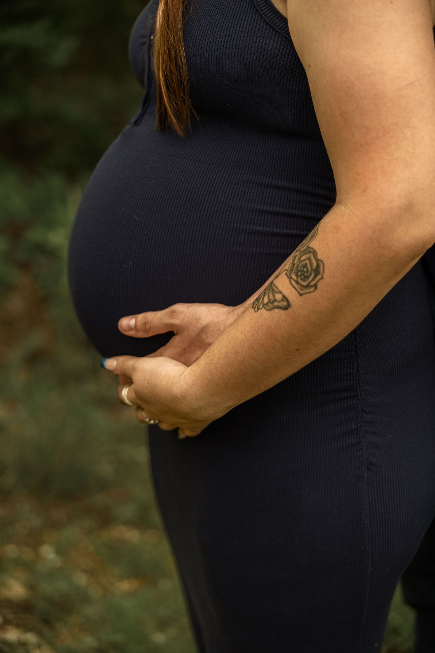 Expecting mother during a maternity session with natural posing, soft light, and timeless portraits celebrating motherhood.