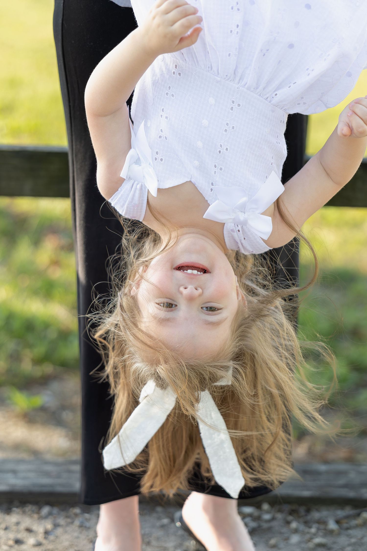 Family portrait session capturing genuine smiles, natural interactions, and timeless memories in a beautiful outdoor setting.