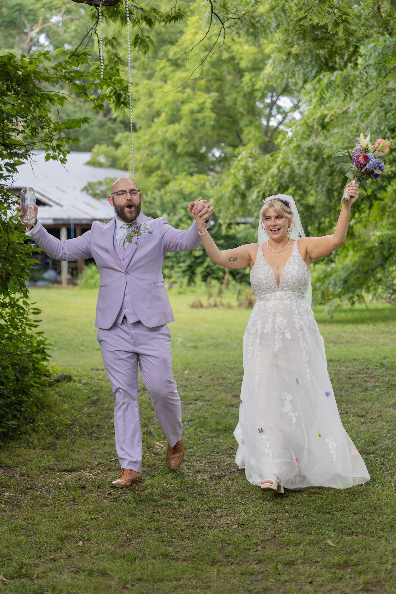 Bride and groom sharing joyful moments on their wedding day with timeless portraits, candid emotions, and elegant details.
