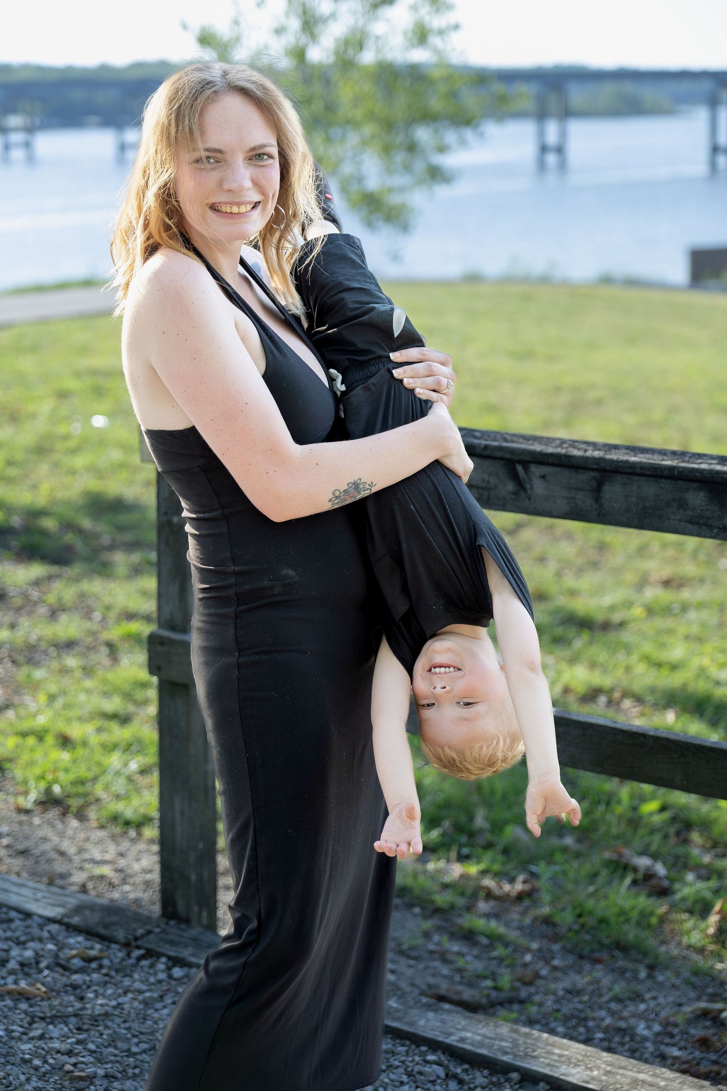 Family portrait session capturing genuine smiles, natural interactions, and timeless memories in a beautiful outdoor setting.