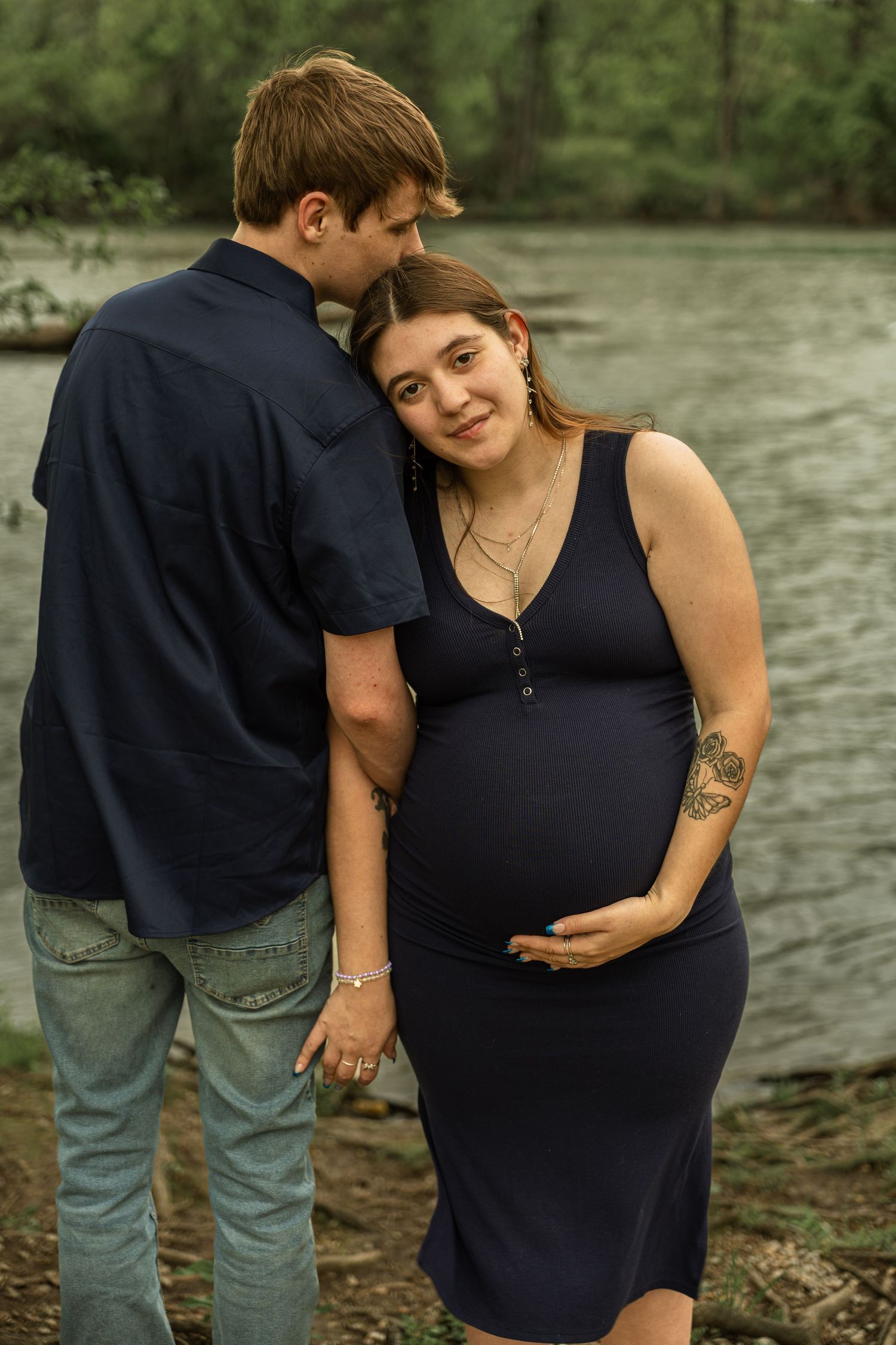 Expecting mother during a maternity session with natural posing, soft light, and timeless portraits celebrating motherhood.