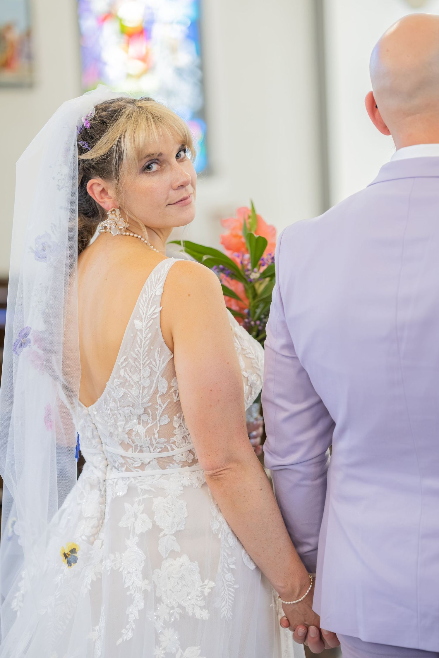 Bride and groom sharing joyful moments on their wedding day with timeless portraits, candid emotions, and elegant details.