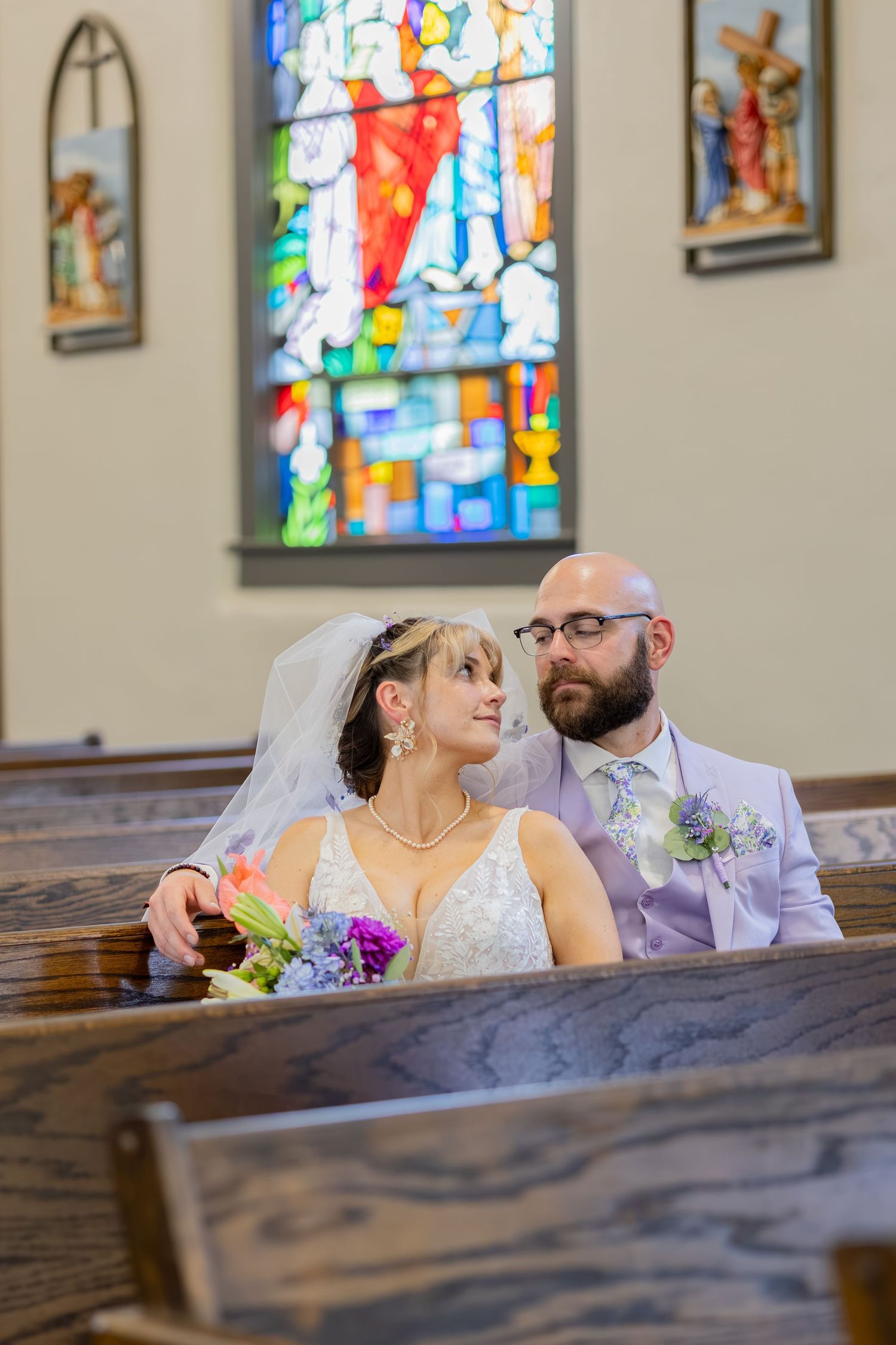 Bride and groom sharing joyful moments on their wedding day with timeless portraits, candid emotions, and elegant details.