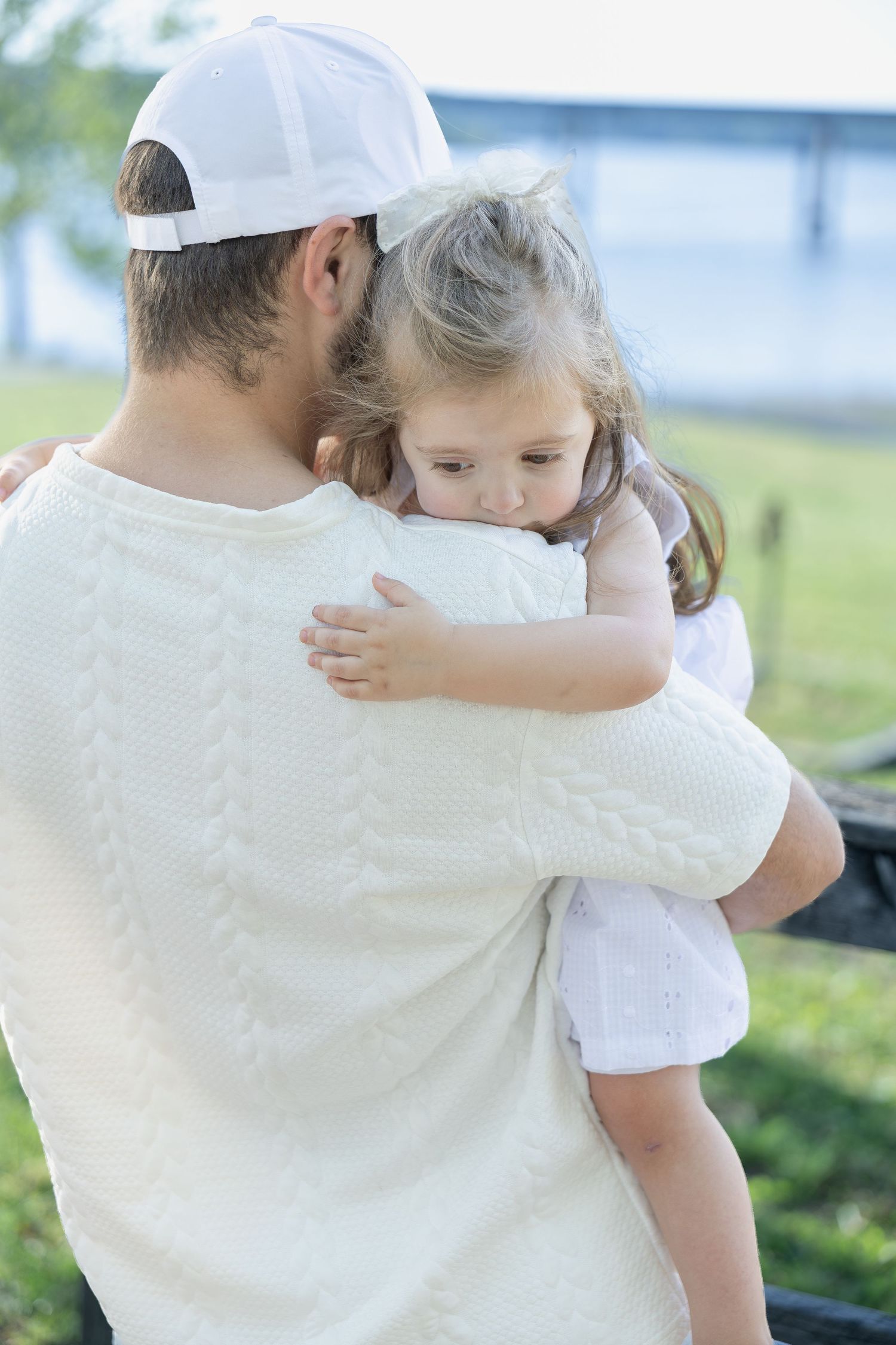 Family portrait session capturing genuine smiles, natural interactions, and timeless memories in a beautiful outdoor setting.
