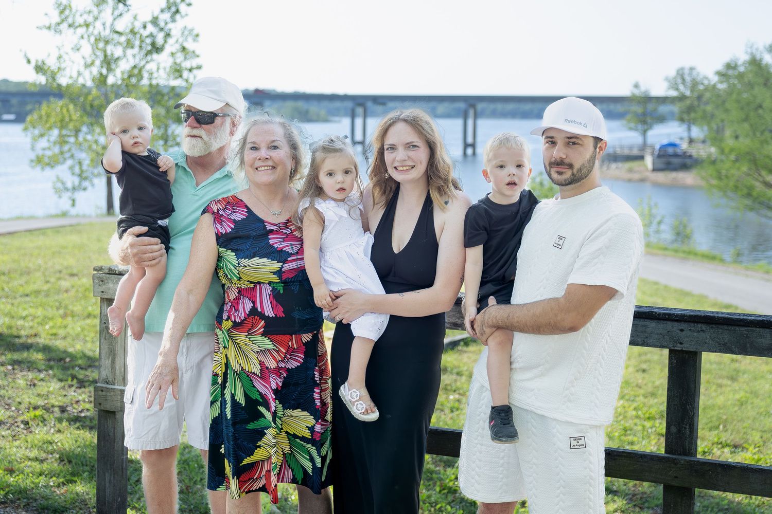 Family portrait session capturing genuine smiles, natural interactions, and timeless memories in a beautiful outdoor setting.