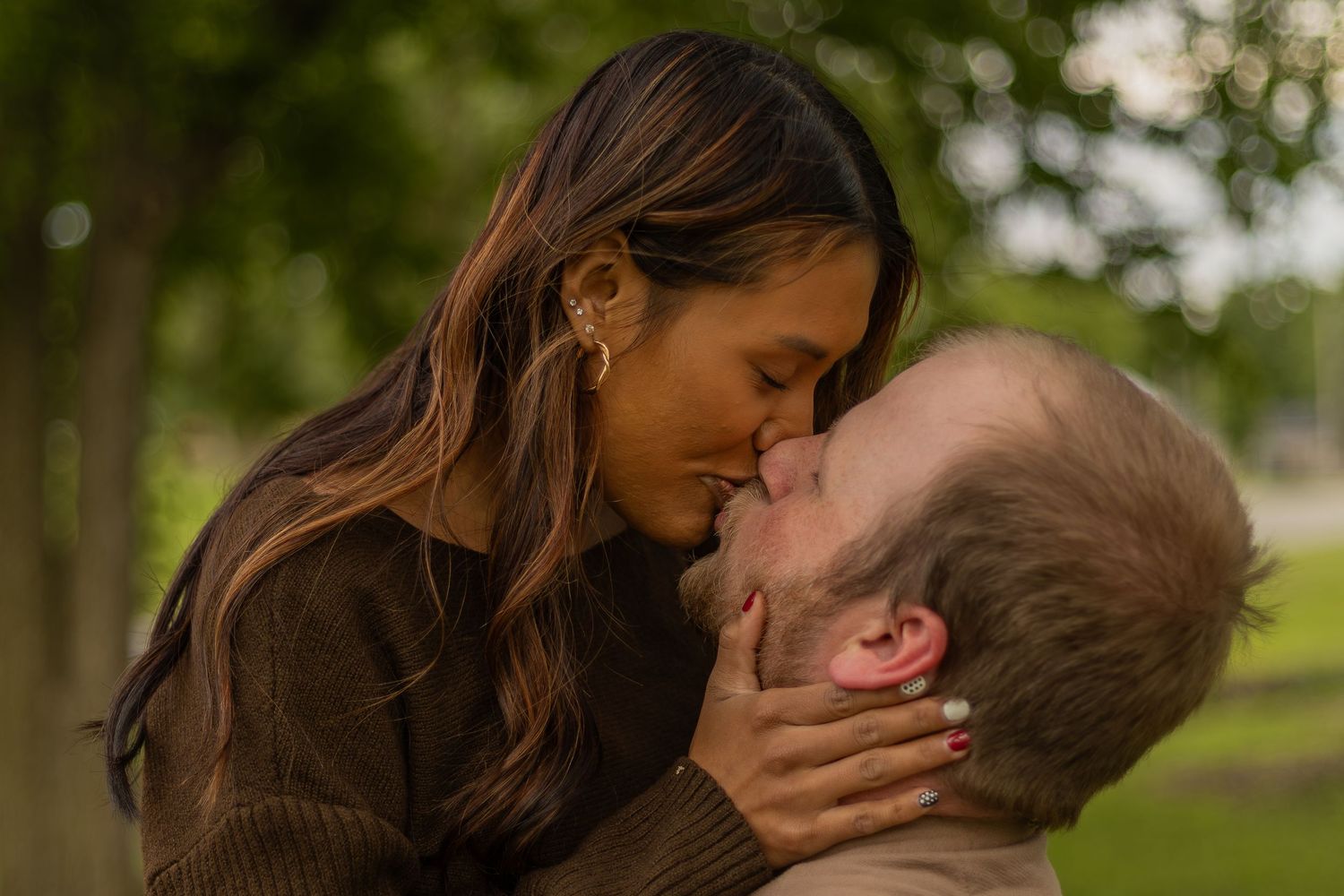 Romantic couples session with candid moments, natural poses, and golden-hour light in a scenic outdoor location.