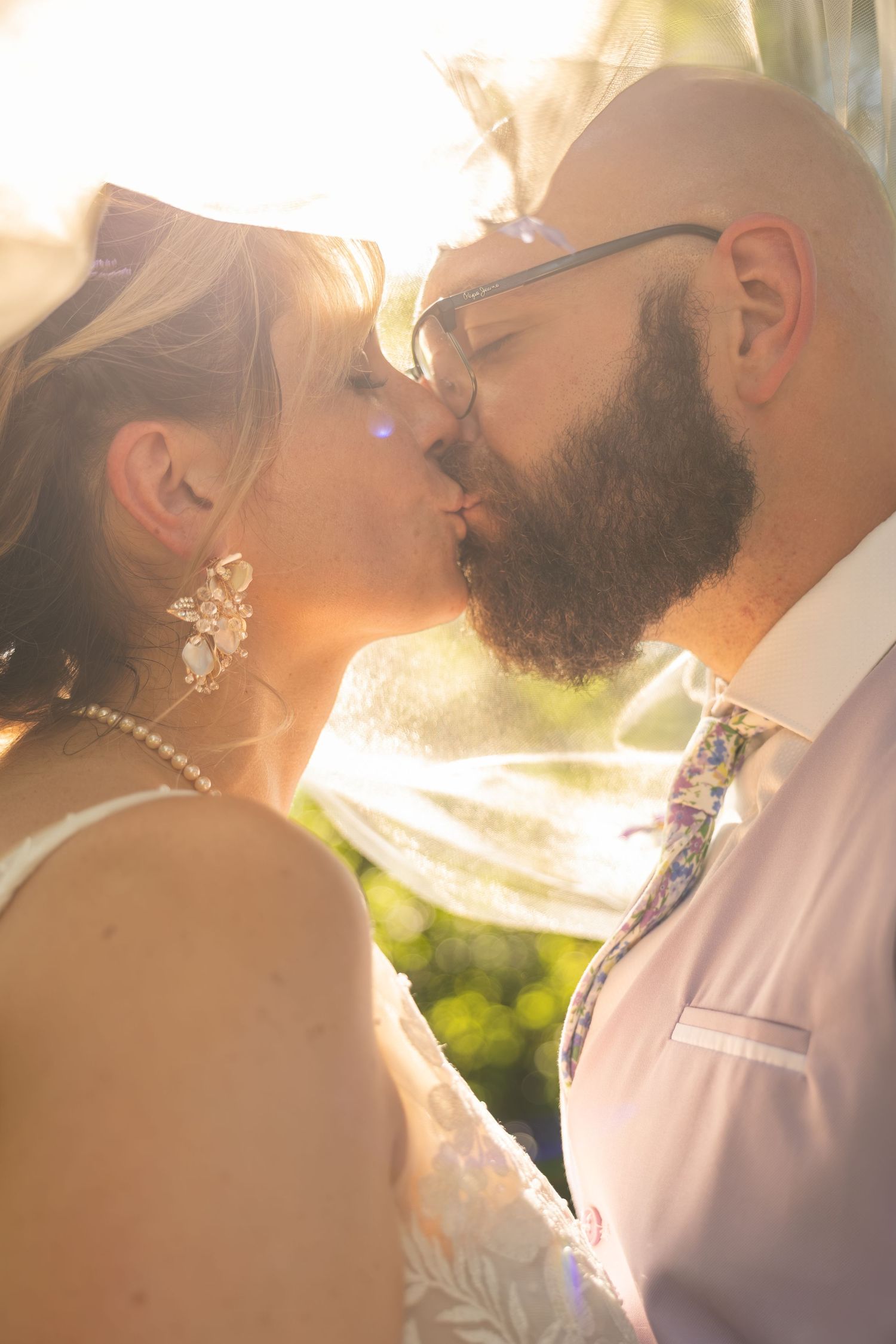 Bride and groom sharing joyful moments on their wedding day with timeless portraits, candid emotions, and elegant details.