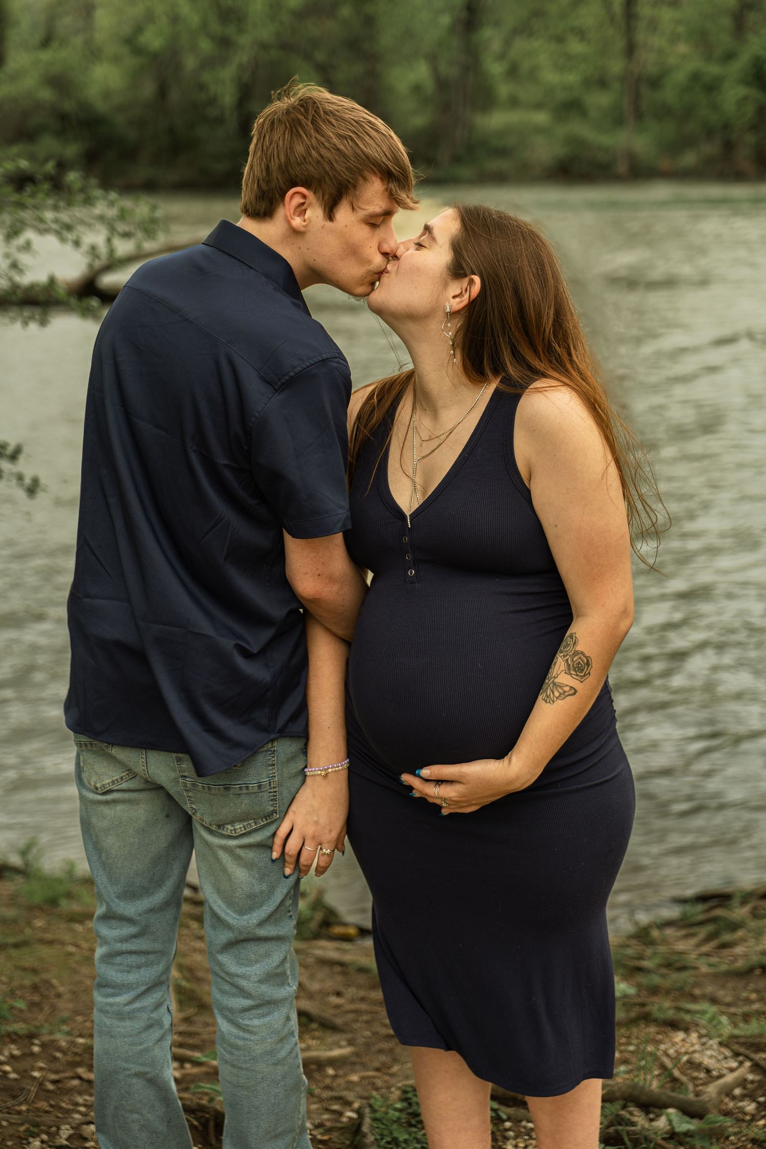 Expecting mother during a maternity session with natural posing, soft light, and timeless portraits celebrating motherhood.