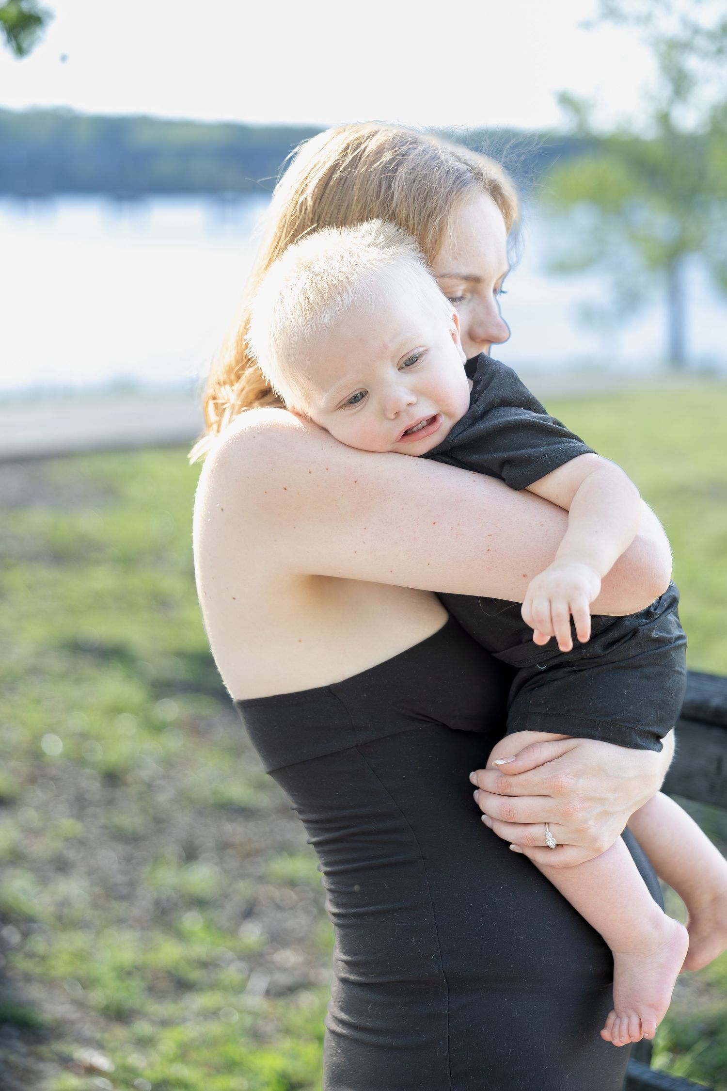 Family portrait session capturing genuine smiles, natural interactions, and timeless memories in a beautiful outdoor setting.