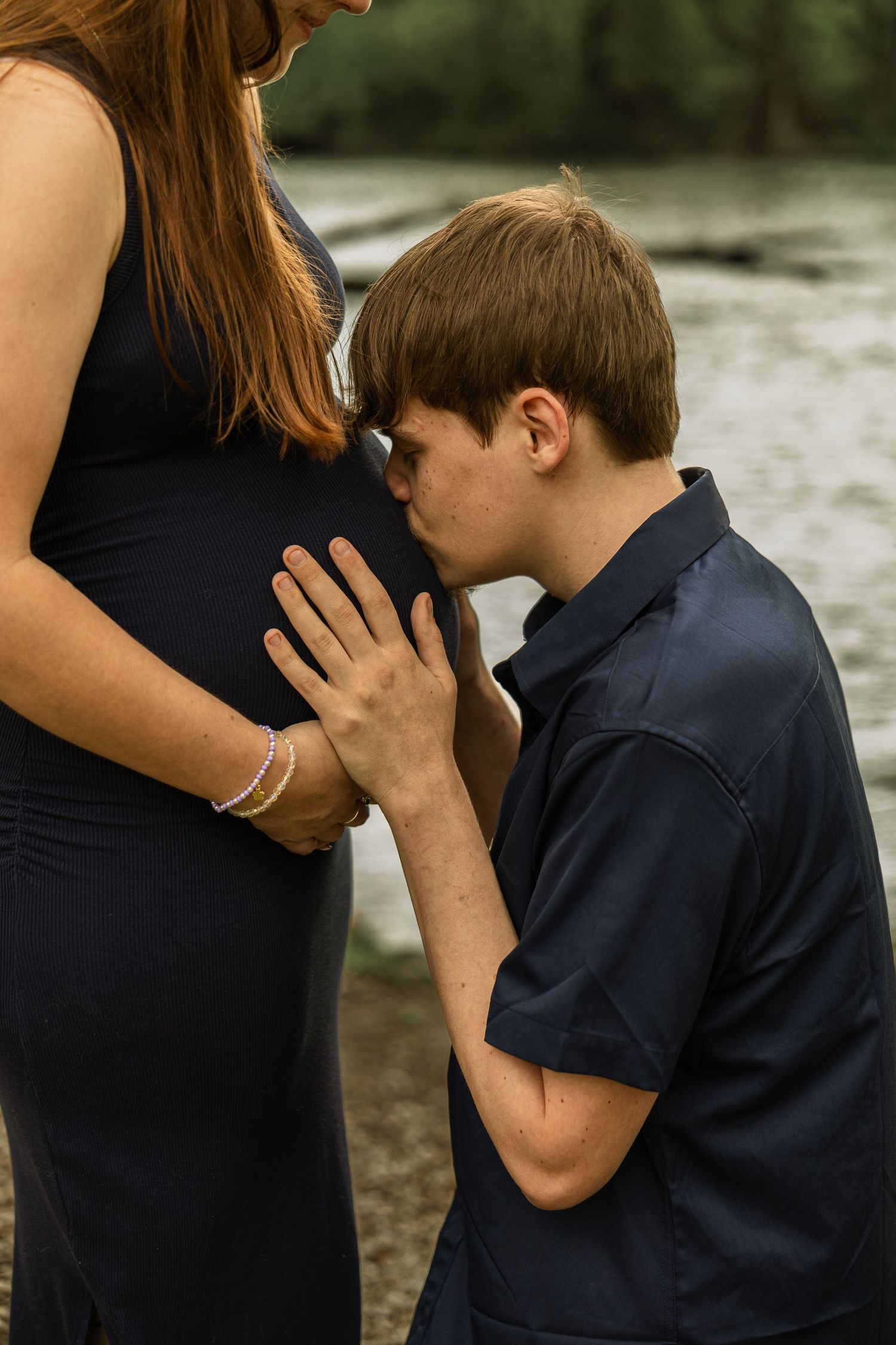 Expecting mother during a maternity session with natural posing, soft light, and timeless portraits celebrating motherhood.