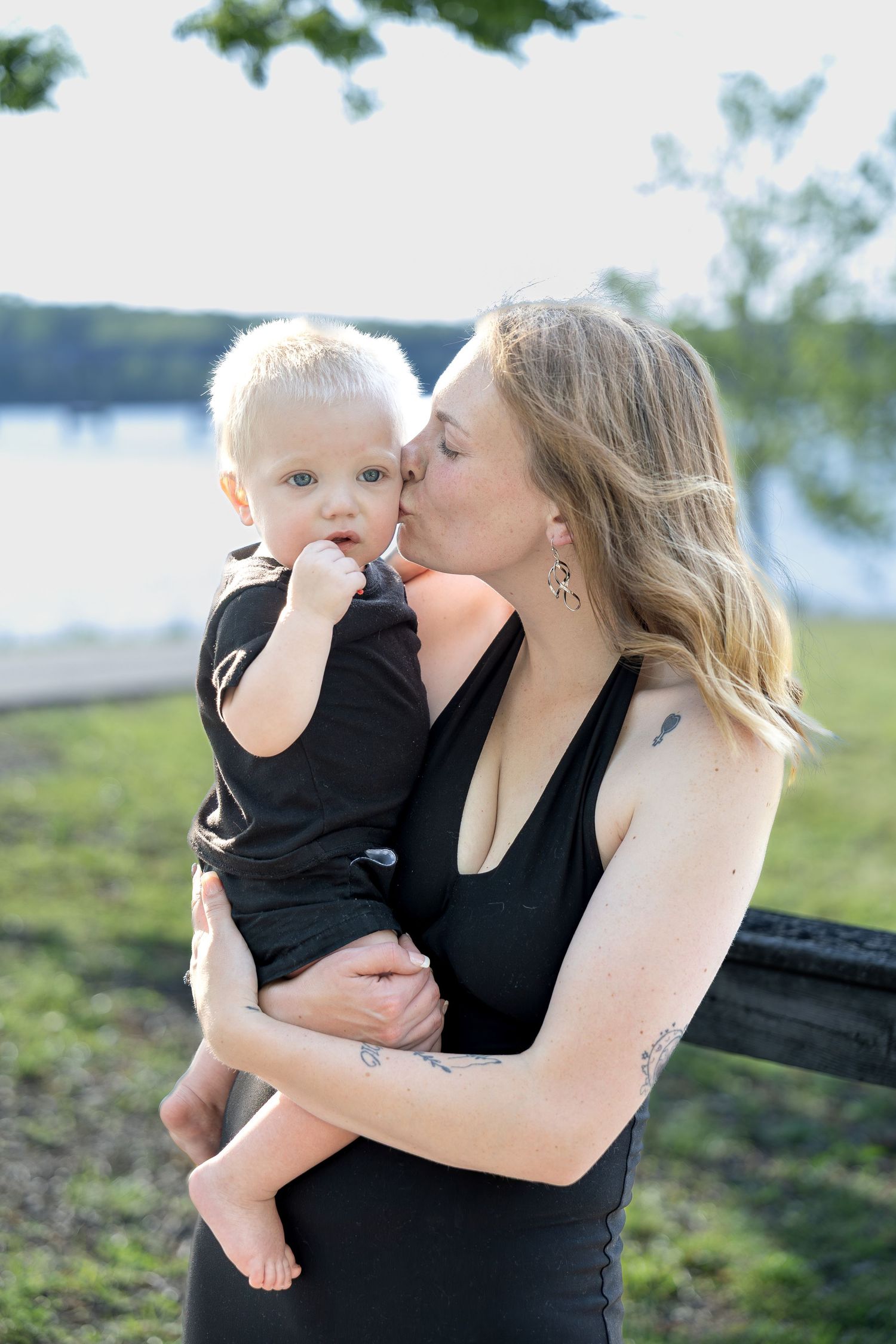 Family portrait session capturing genuine smiles, natural interactions, and timeless memories in a beautiful outdoor setting.