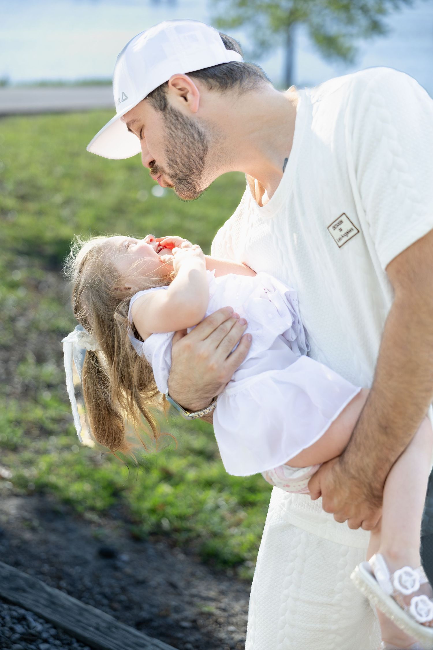 Family portrait session capturing genuine smiles, natural interactions, and timeless memories in a beautiful outdoor setting.