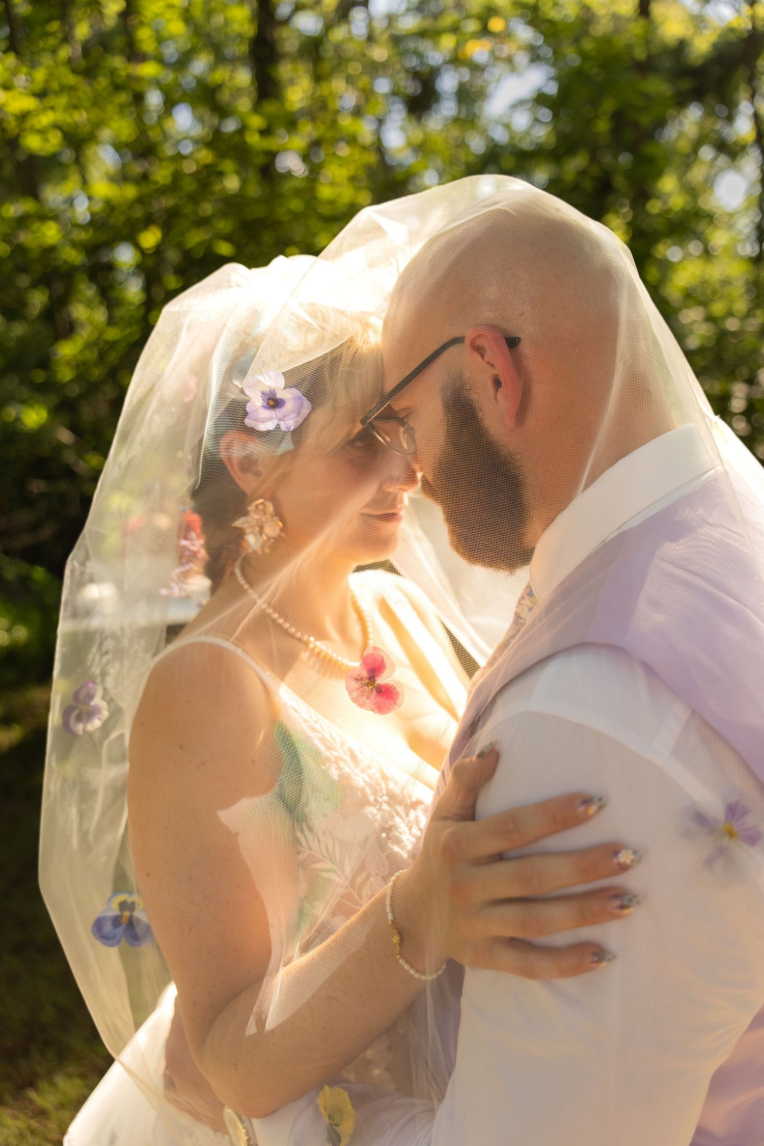 Bride and groom sharing joyful moments on their wedding day with timeless portraits, candid emotions, and elegant details.