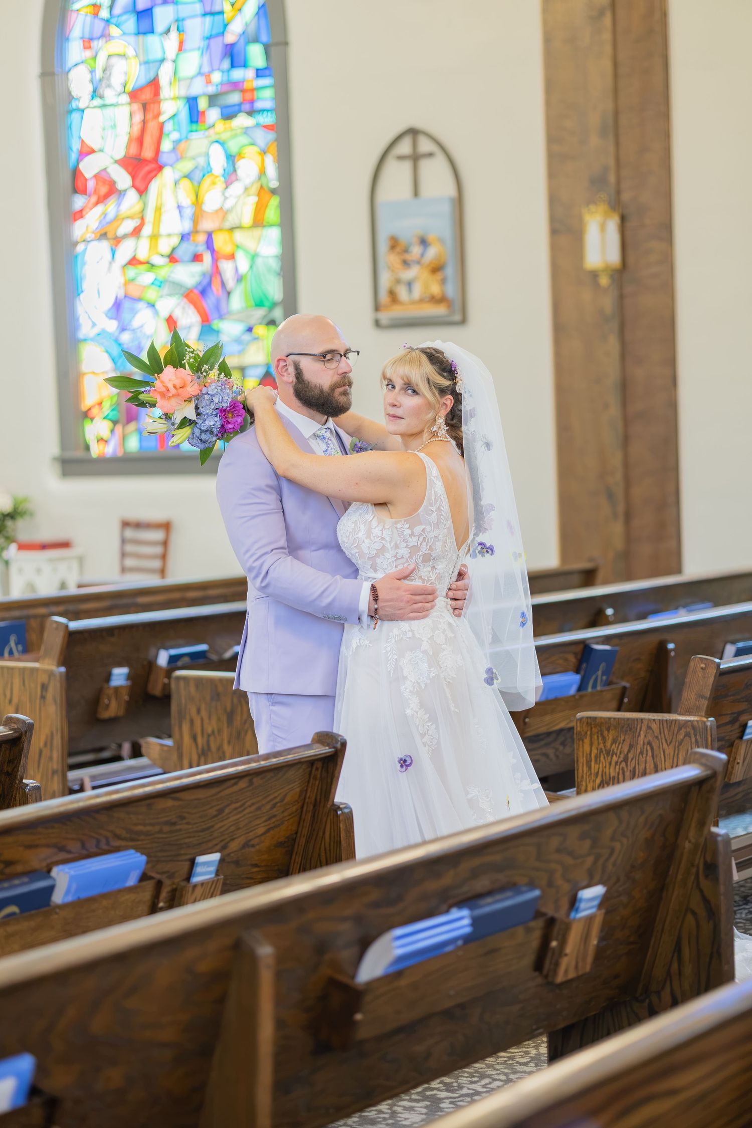 Bride and groom sharing joyful moments on their wedding day with timeless portraits, candid emotions, and elegant details.