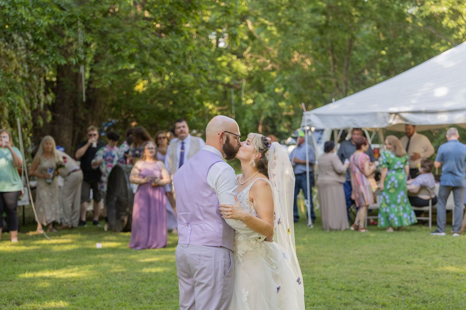 Bride and groom sharing joyful moments on their wedding day with timeless portraits, candid emotions, and elegant details.