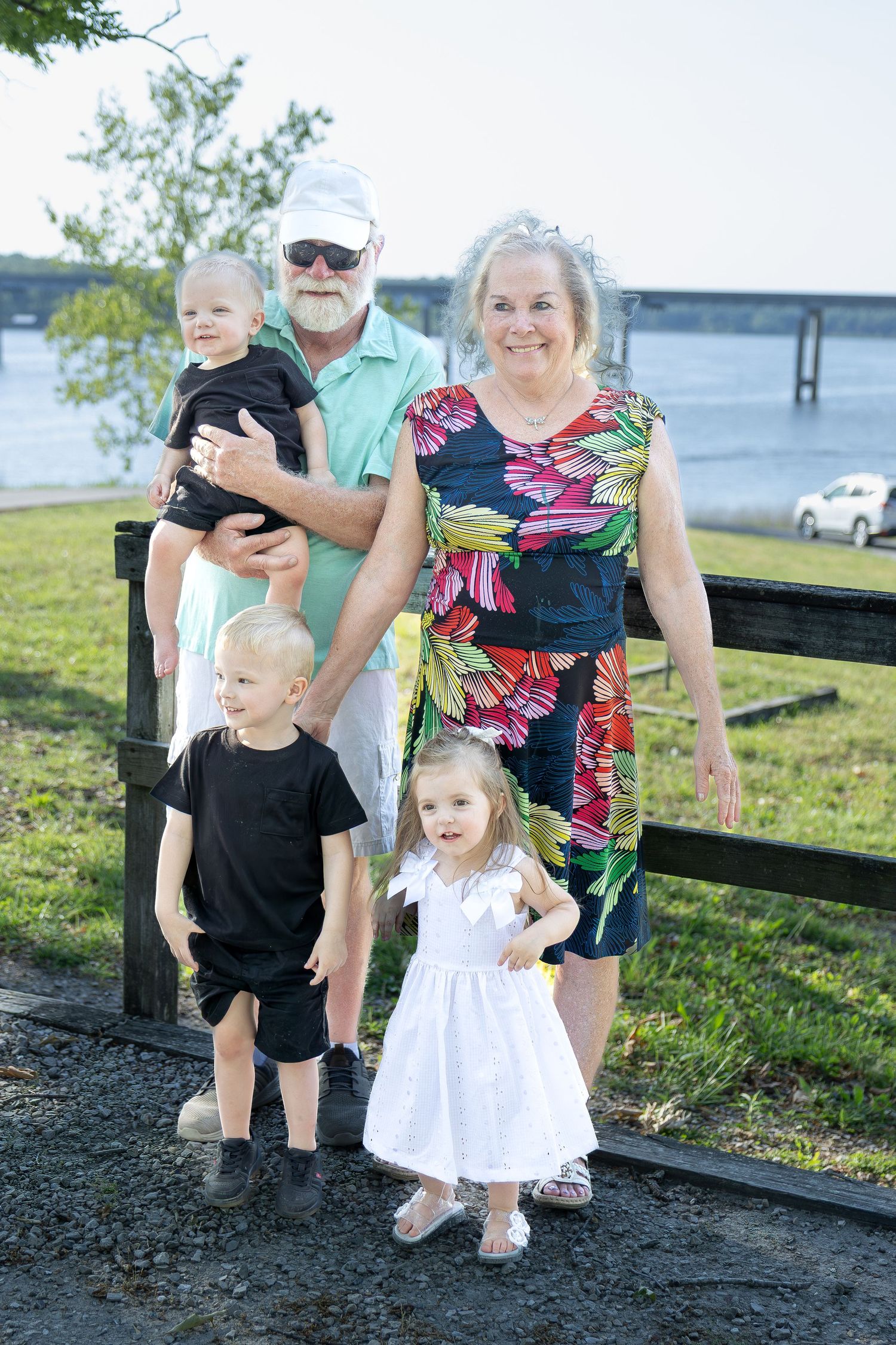 Family portrait session capturing genuine smiles, natural interactions, and timeless memories in a beautiful outdoor setting.