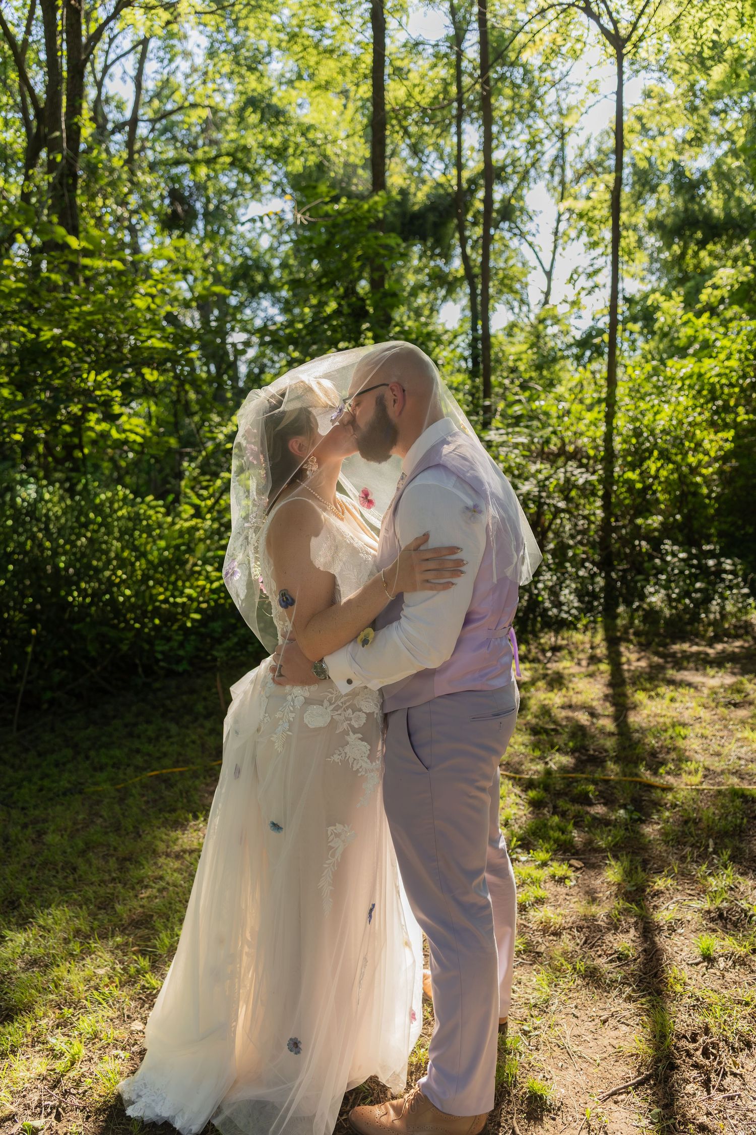 Bride and groom sharing joyful moments on their wedding day with timeless portraits, candid emotions, and elegant details.