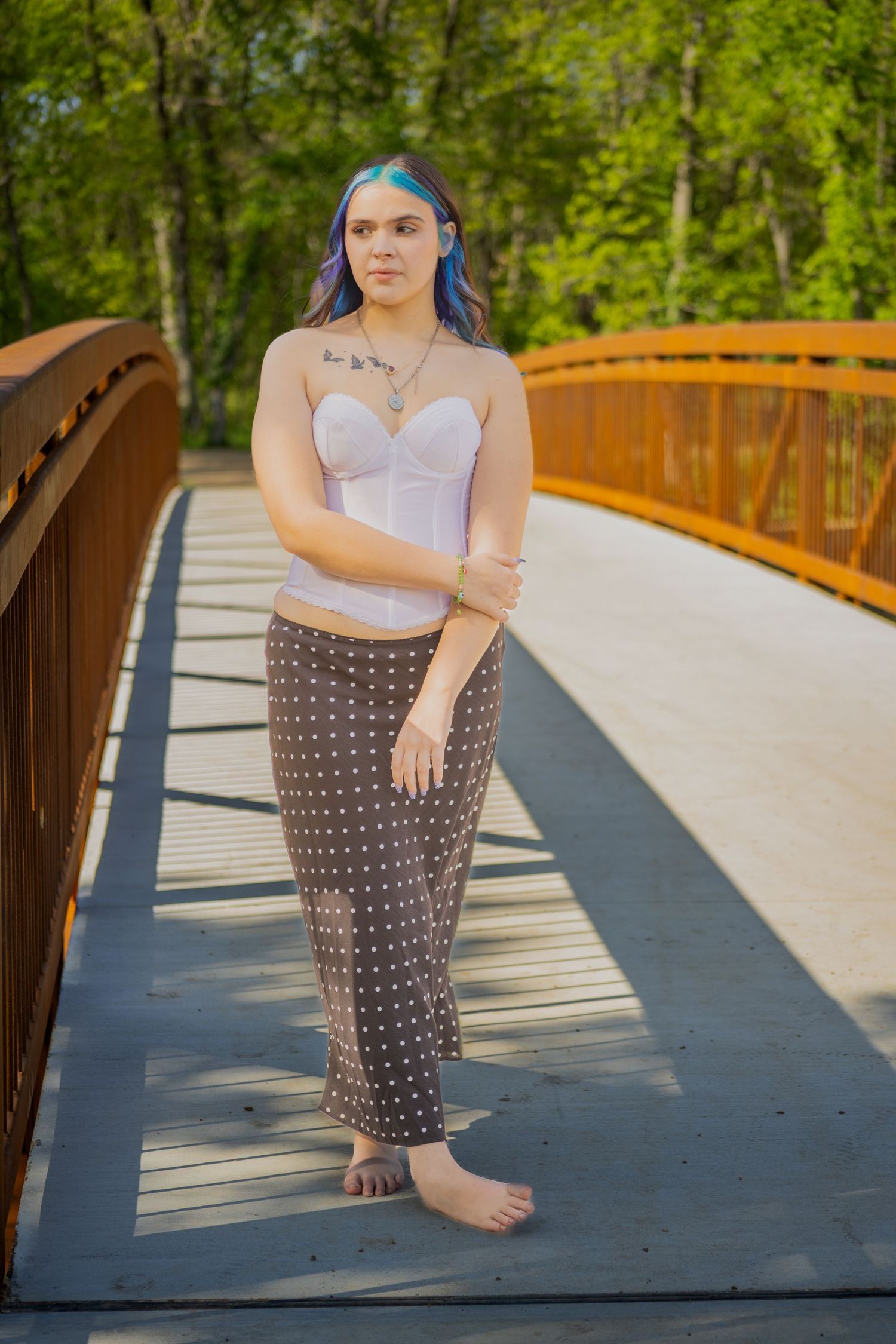 High school senior portrait at golden hour with natural posing, genuine smiles, and timeless editing in Southwest Missouri.