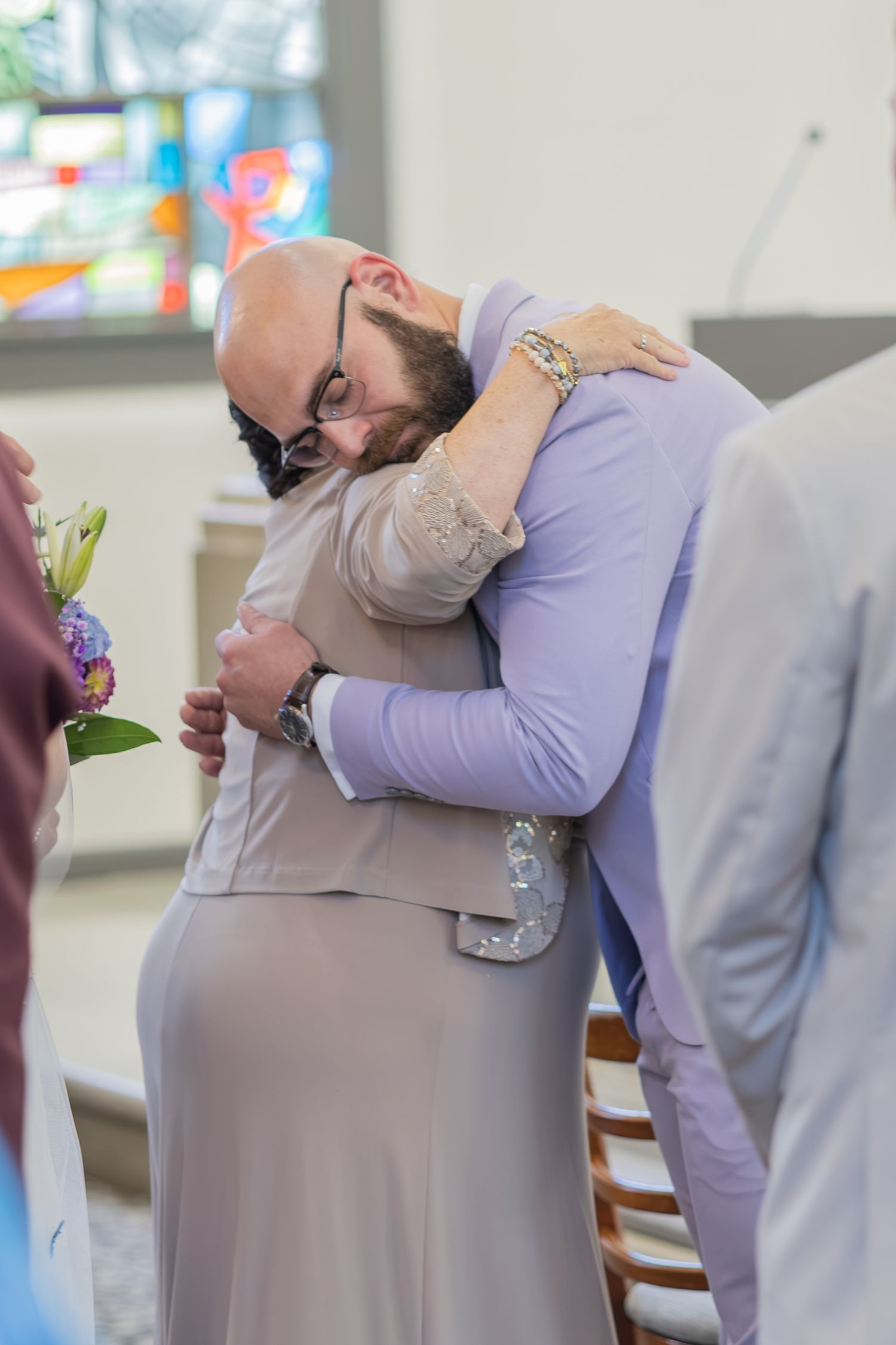 Bride and groom sharing joyful moments on their wedding day with timeless portraits, candid emotions, and elegant details.
