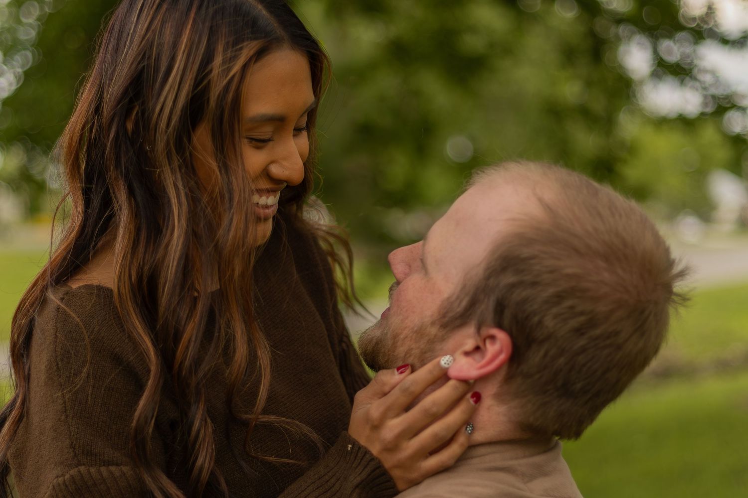 Romantic couples session with candid moments, natural poses, and golden-hour light in a scenic outdoor location.