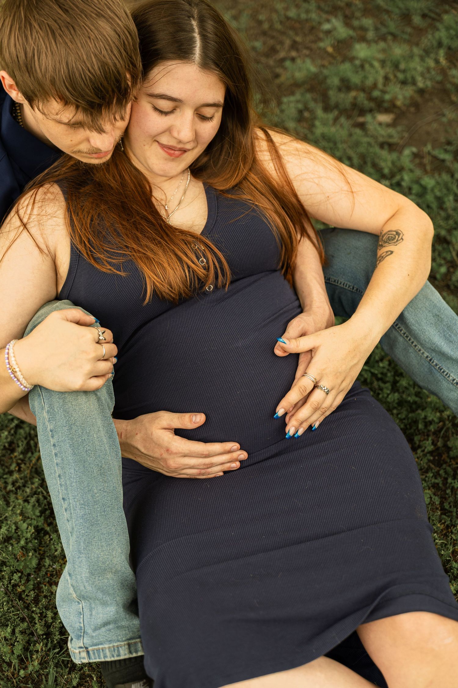 Expecting mother during a maternity session with natural posing, soft light, and timeless portraits celebrating motherhood.