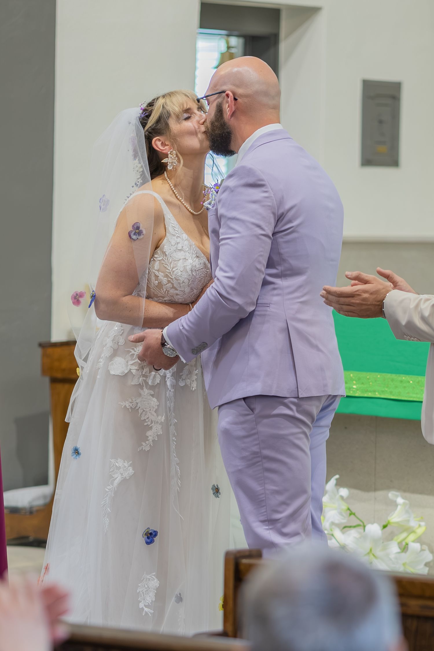 Bride and groom sharing joyful moments on their wedding day with timeless portraits, candid emotions, and elegant details.