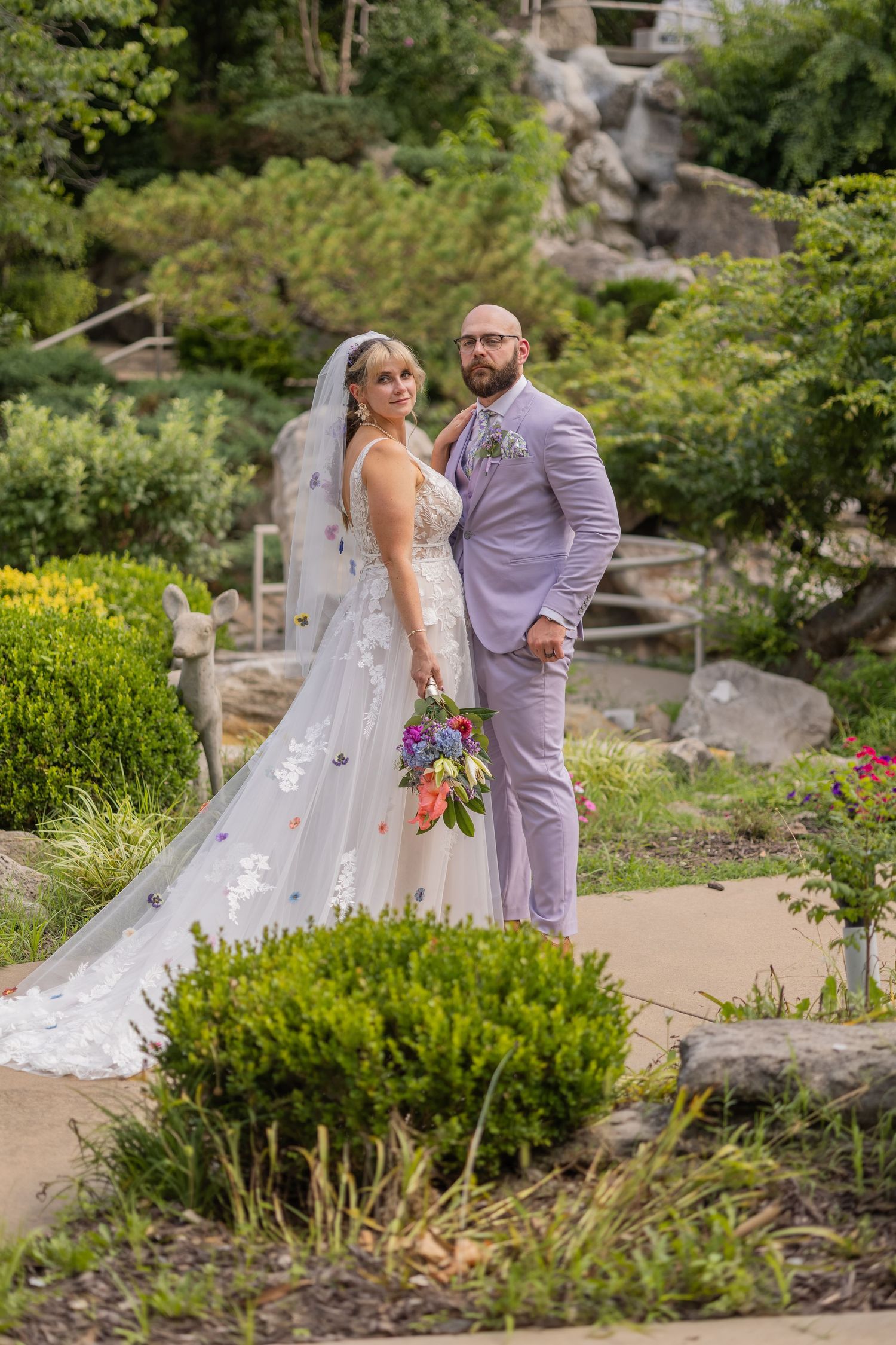 Bride and groom sharing joyful moments on their wedding day with timeless portraits, candid emotions, and elegant details.