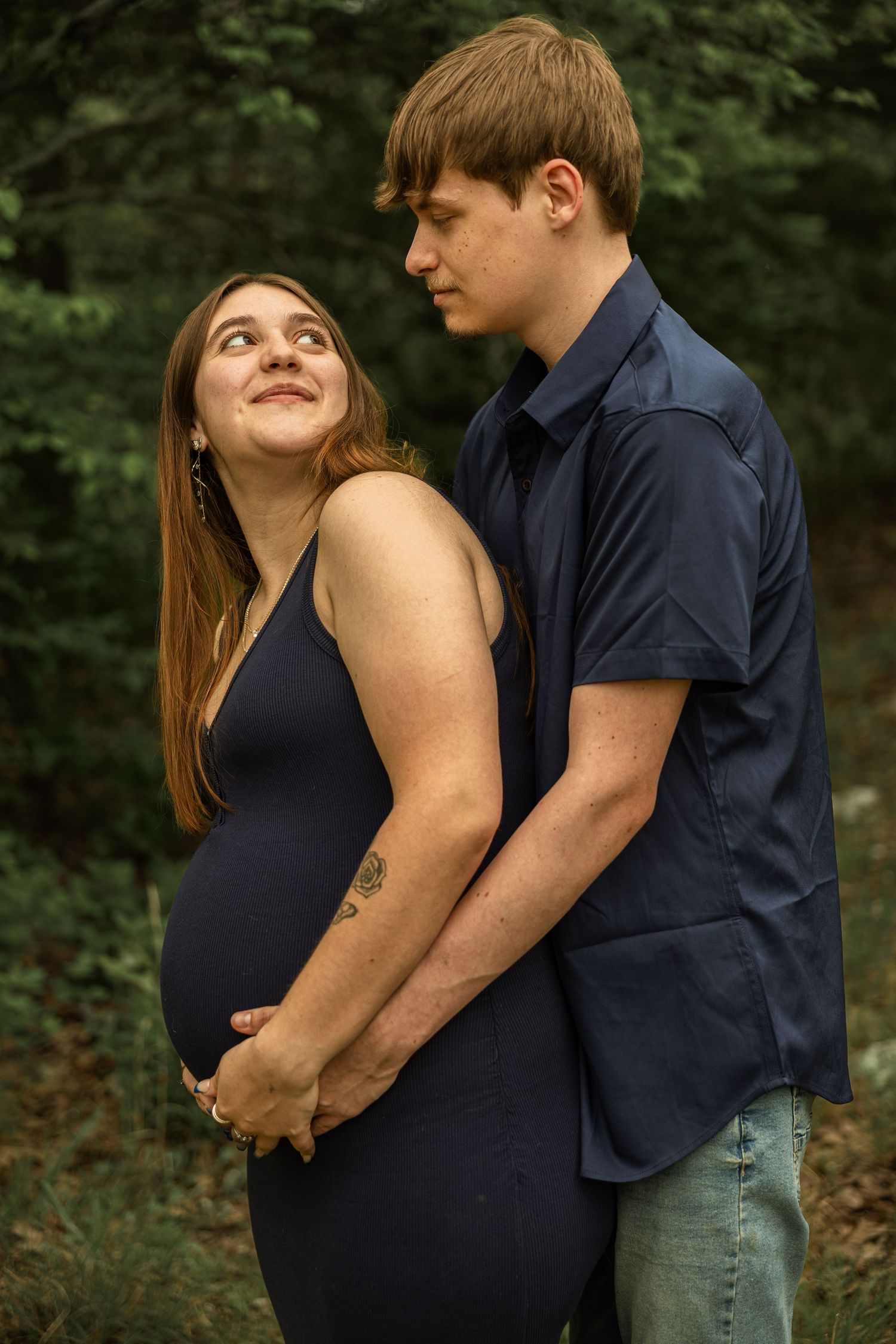 Expecting mother during a maternity session with natural posing, soft light, and timeless portraits celebrating motherhood.