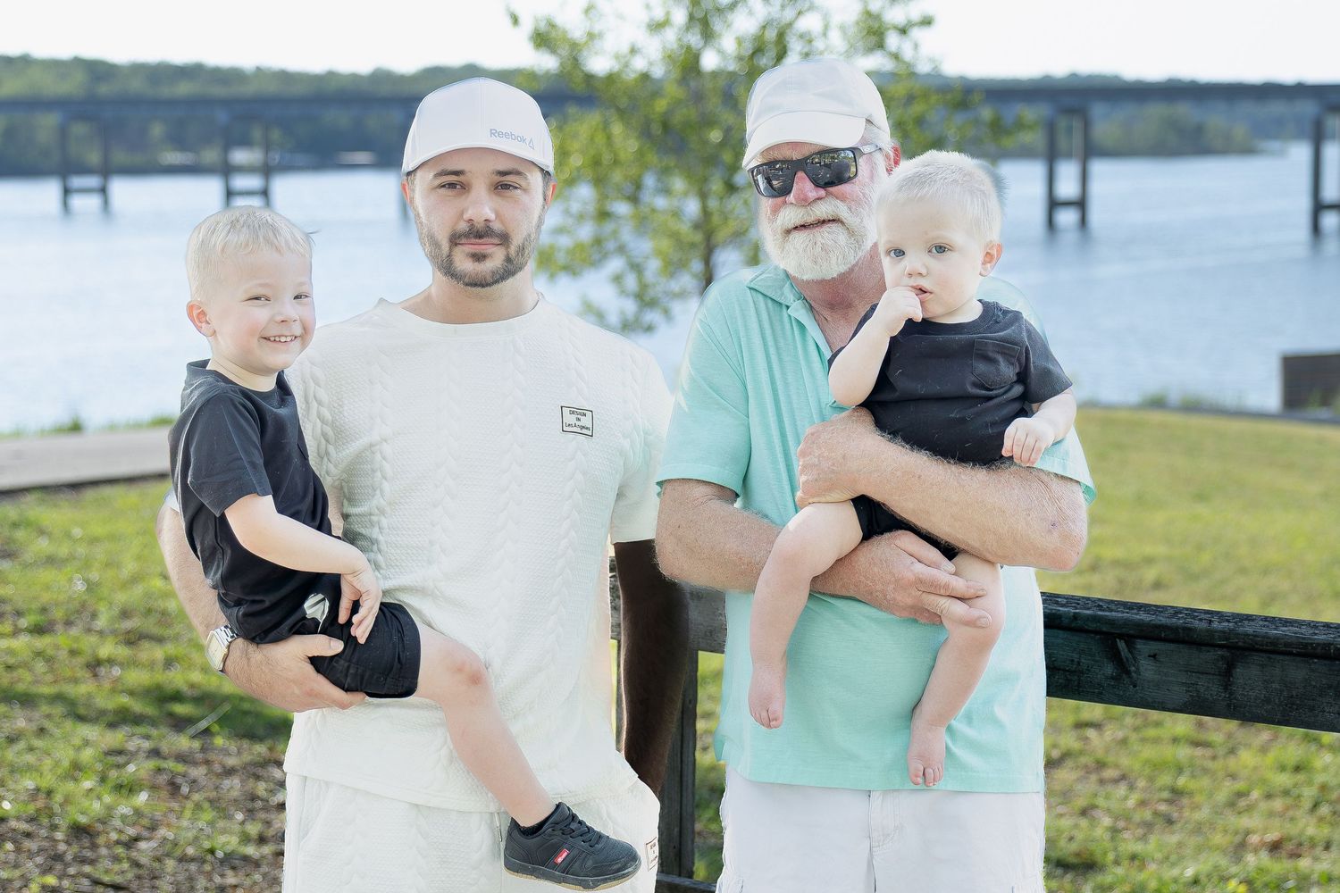 Family portrait session capturing genuine smiles, natural interactions, and timeless memories in a beautiful outdoor setting.